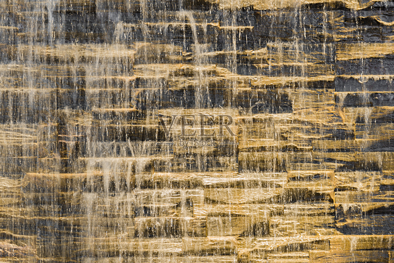 落水流抵石雕粗糙的纹理照片摄影图片