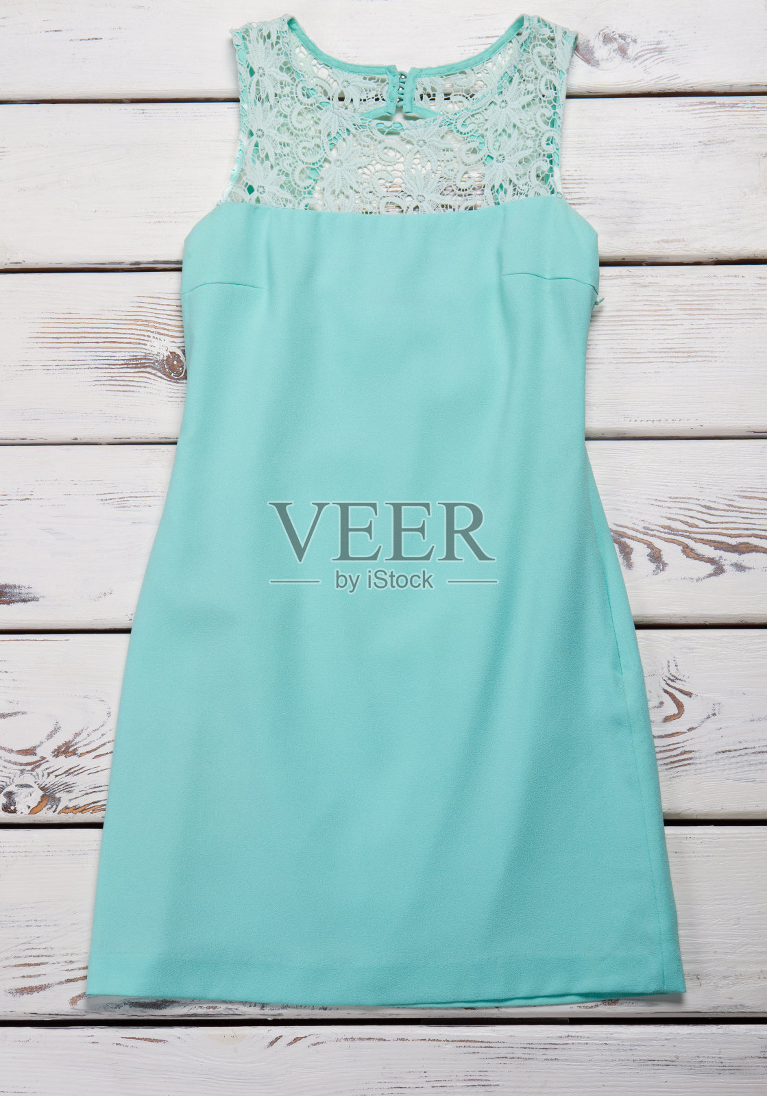 蓝色蕾丝插入连衣裙。照片摄影图片