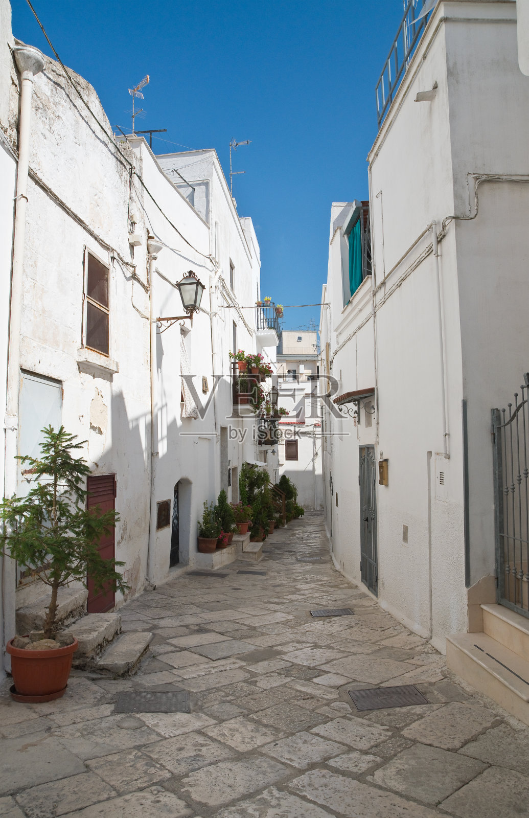 小巷。Mottola这样。普利亚区。意大利。照片摄影图片