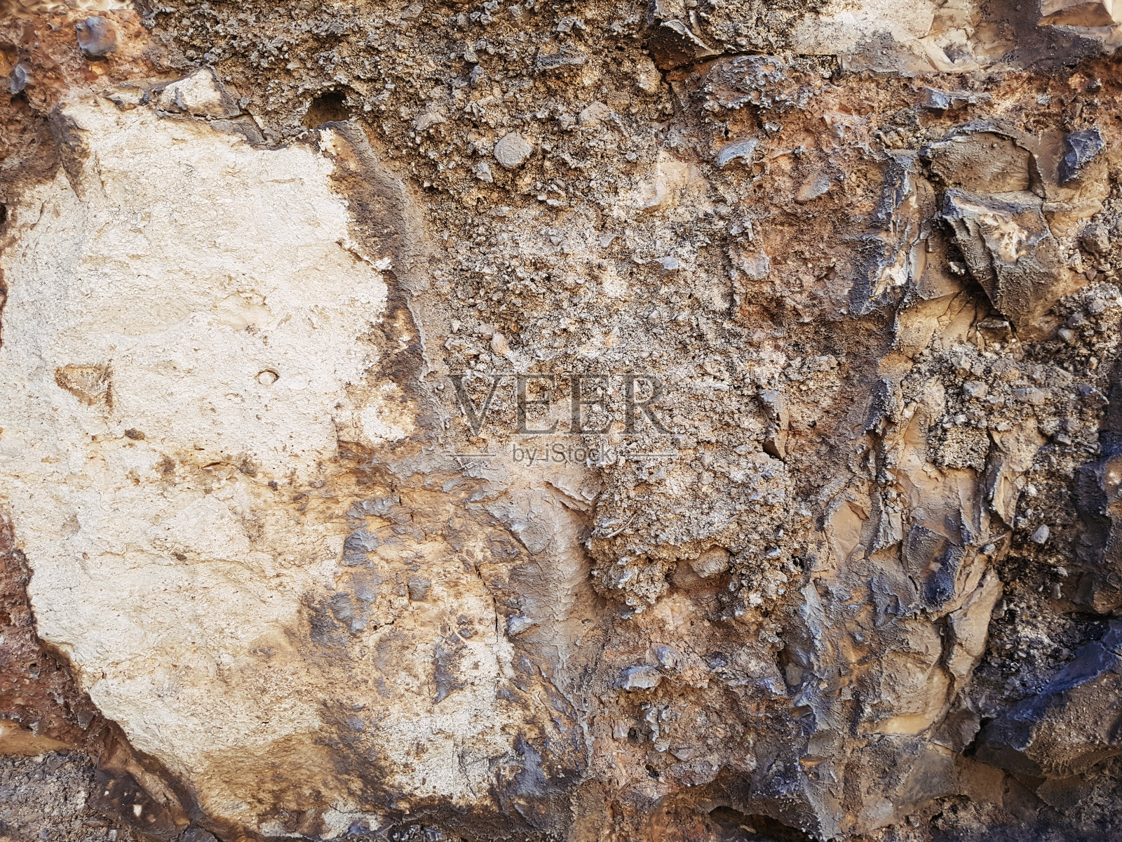 锈迹斑斑的石墙,背景纹理有裂缝照片摄影图片