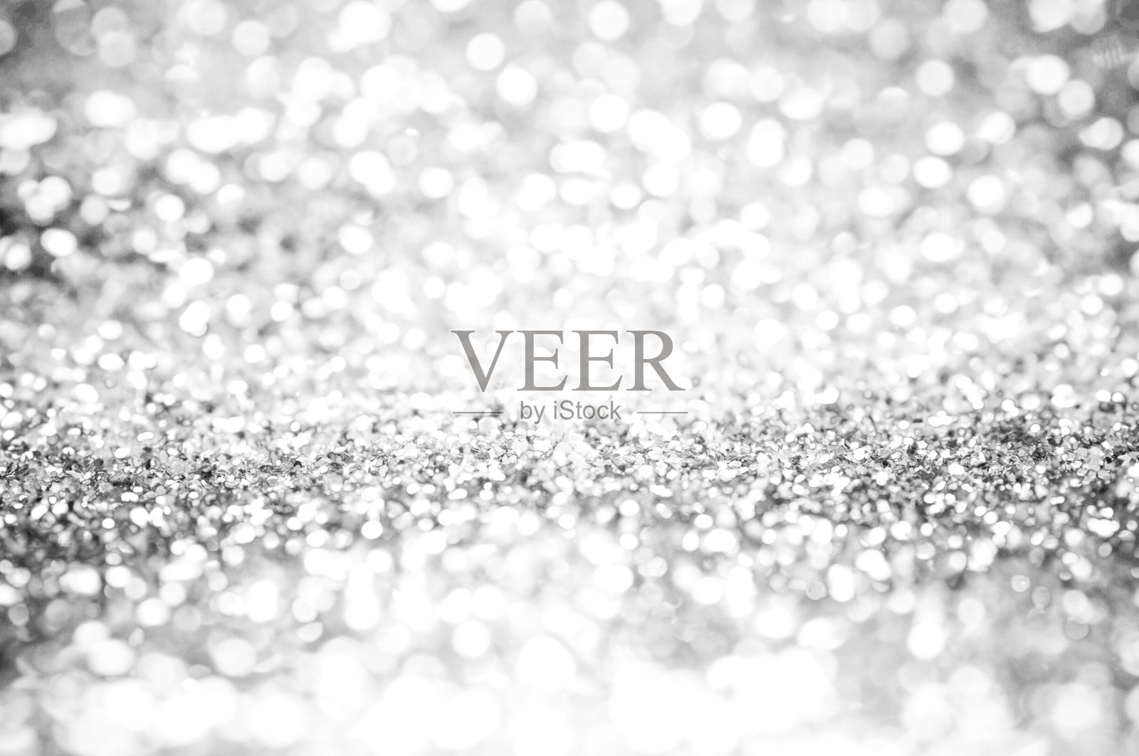 白色和灰色闪闪发光的散景背景照片摄影图片