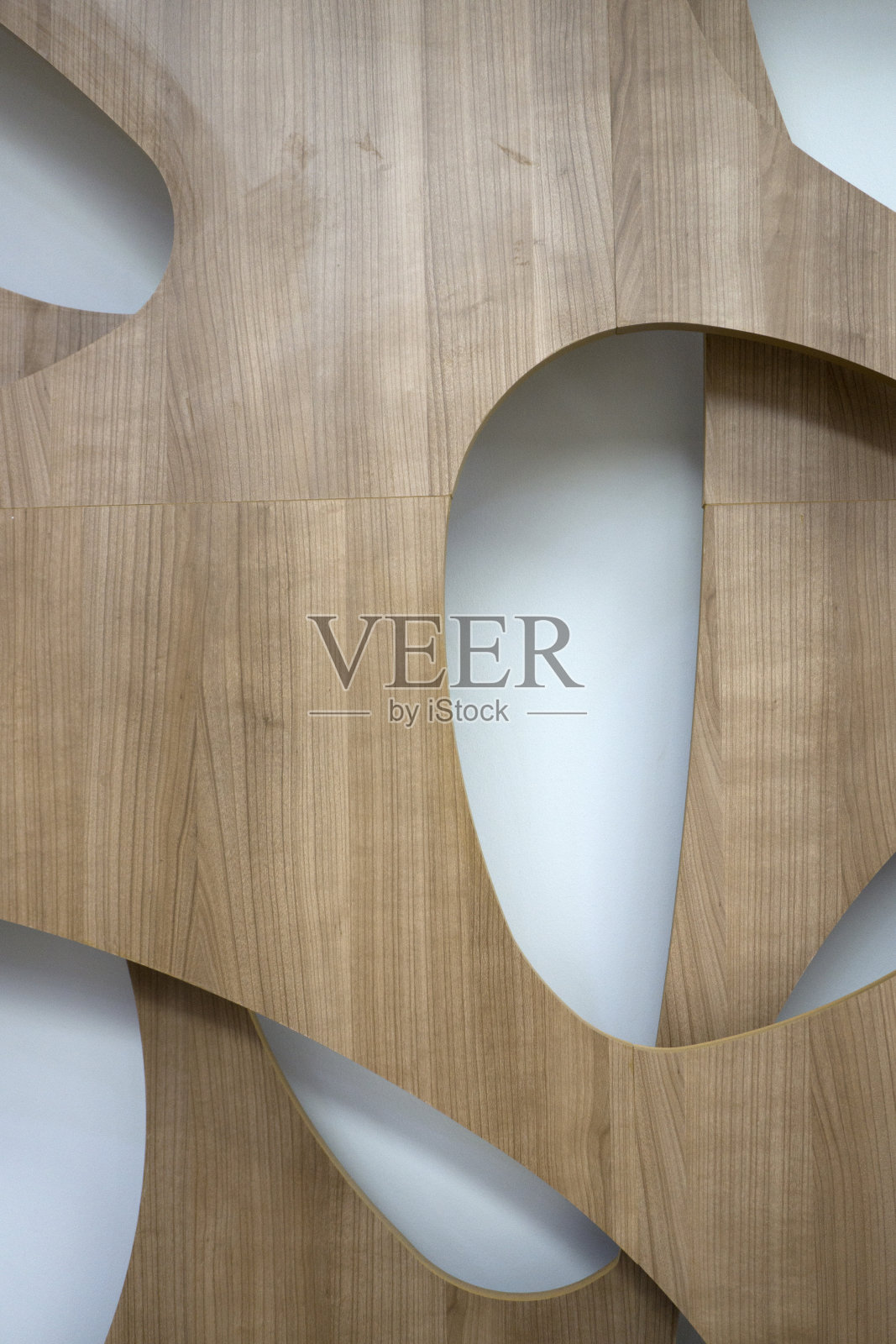 墙装饰。从板子上切出的一个又一个的椭圆形状照片摄影图片