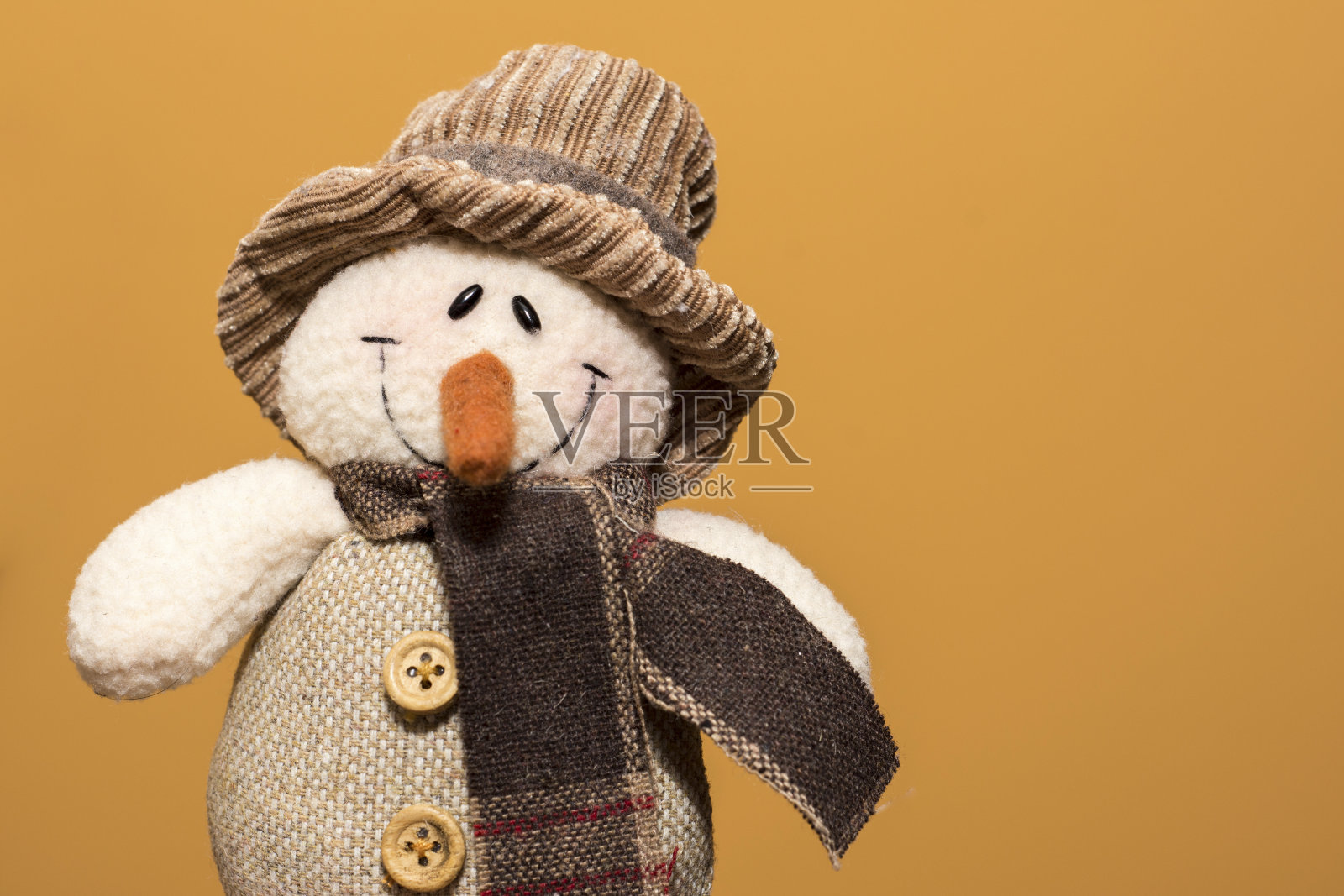 圣诞布娃娃在温暖的背景照片摄影图片