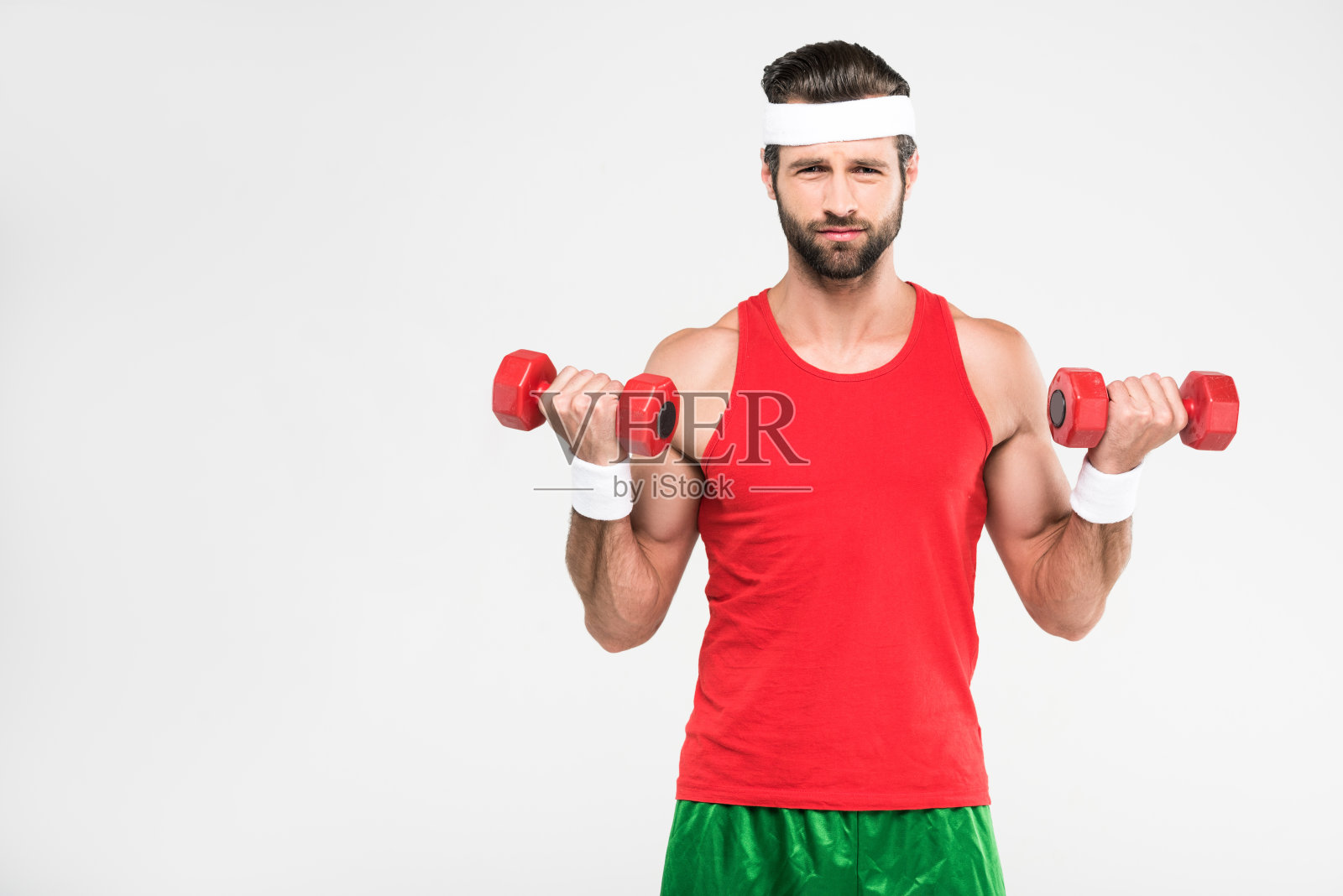 复古的运动员用哑铃锻炼,孤立的白色照片摄影图片