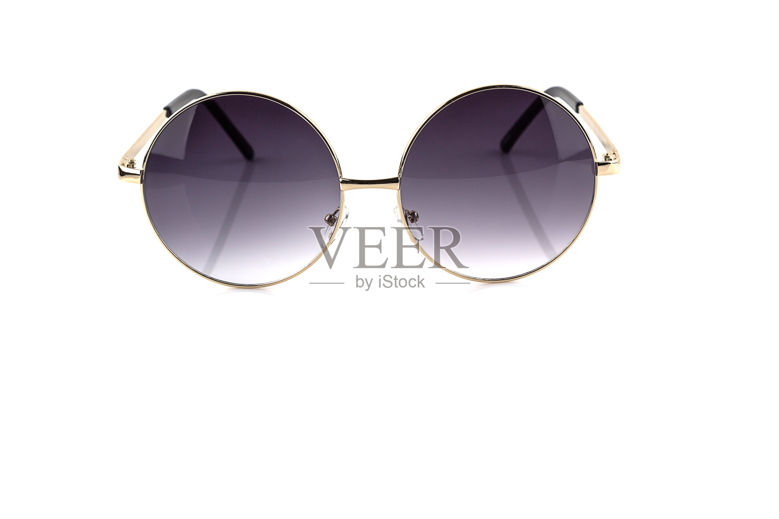 圆形的金色眼镜孤立在白色上照片摄影图片