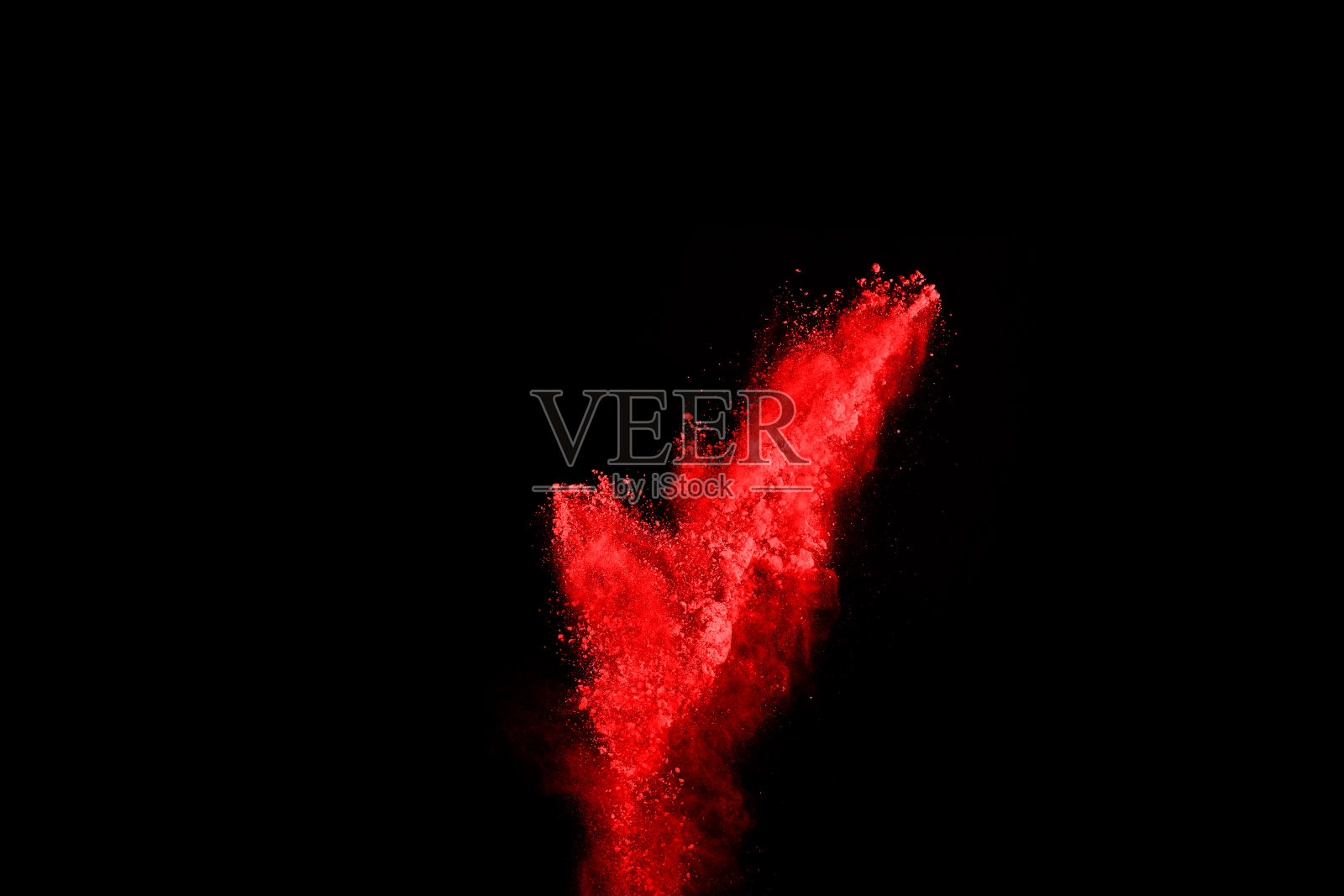 摘要红色粉末在黑色背景上爆炸。抽象的红色粉末溅在黑色背景上。冻结运动的红色粉末爆炸。照片摄影图片
