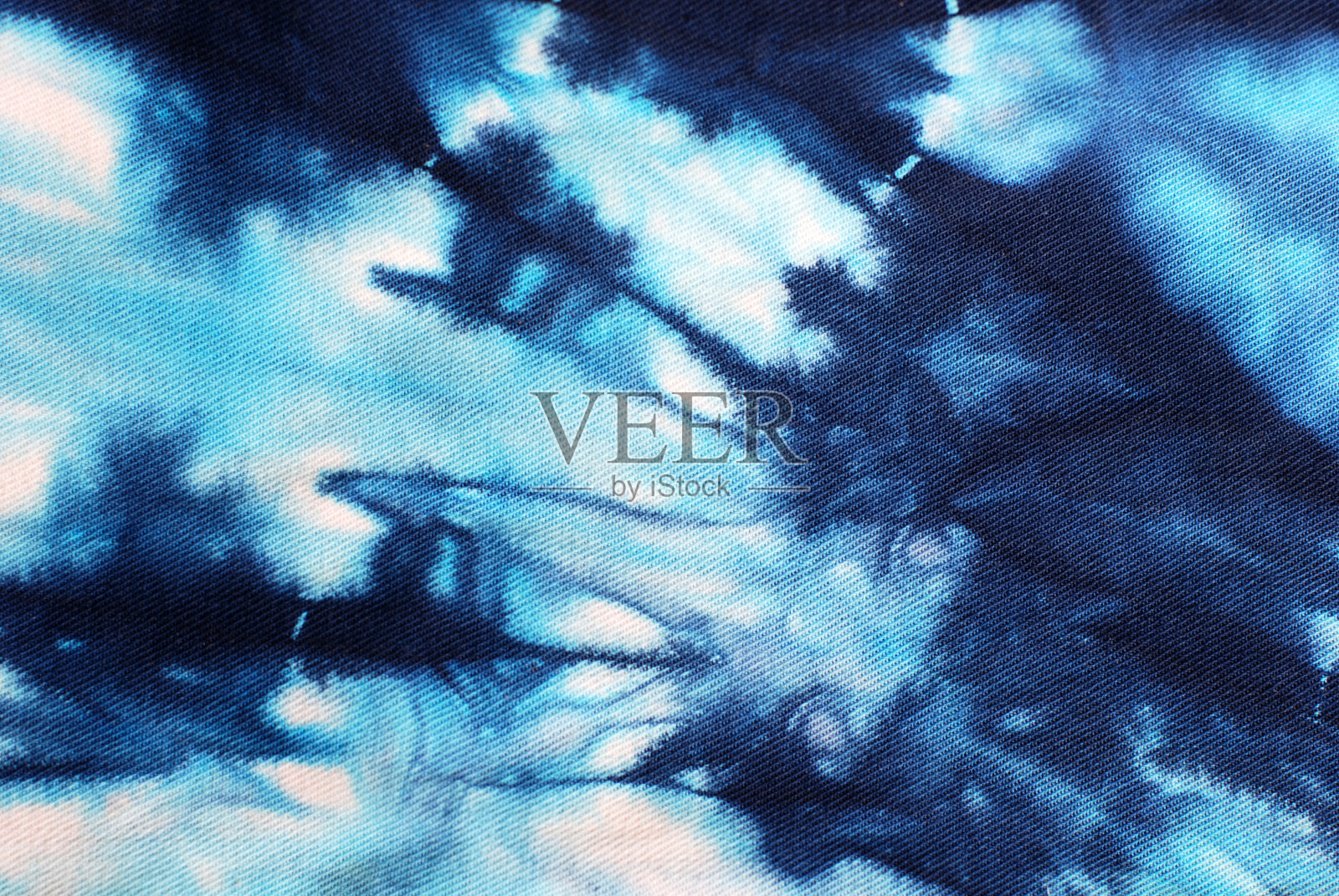 扎染图案抽象背景。照片摄影图片