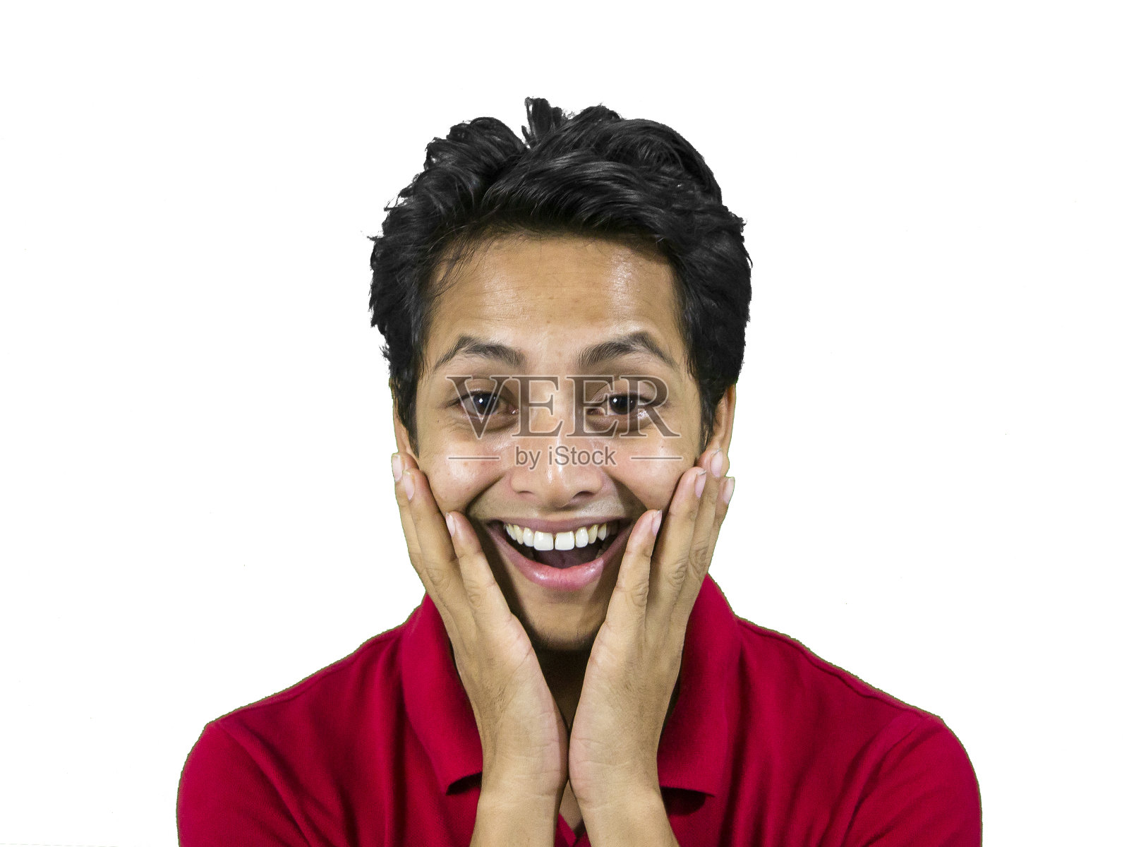 惊讶的年轻人手放在脸颊上。照片摄影图片