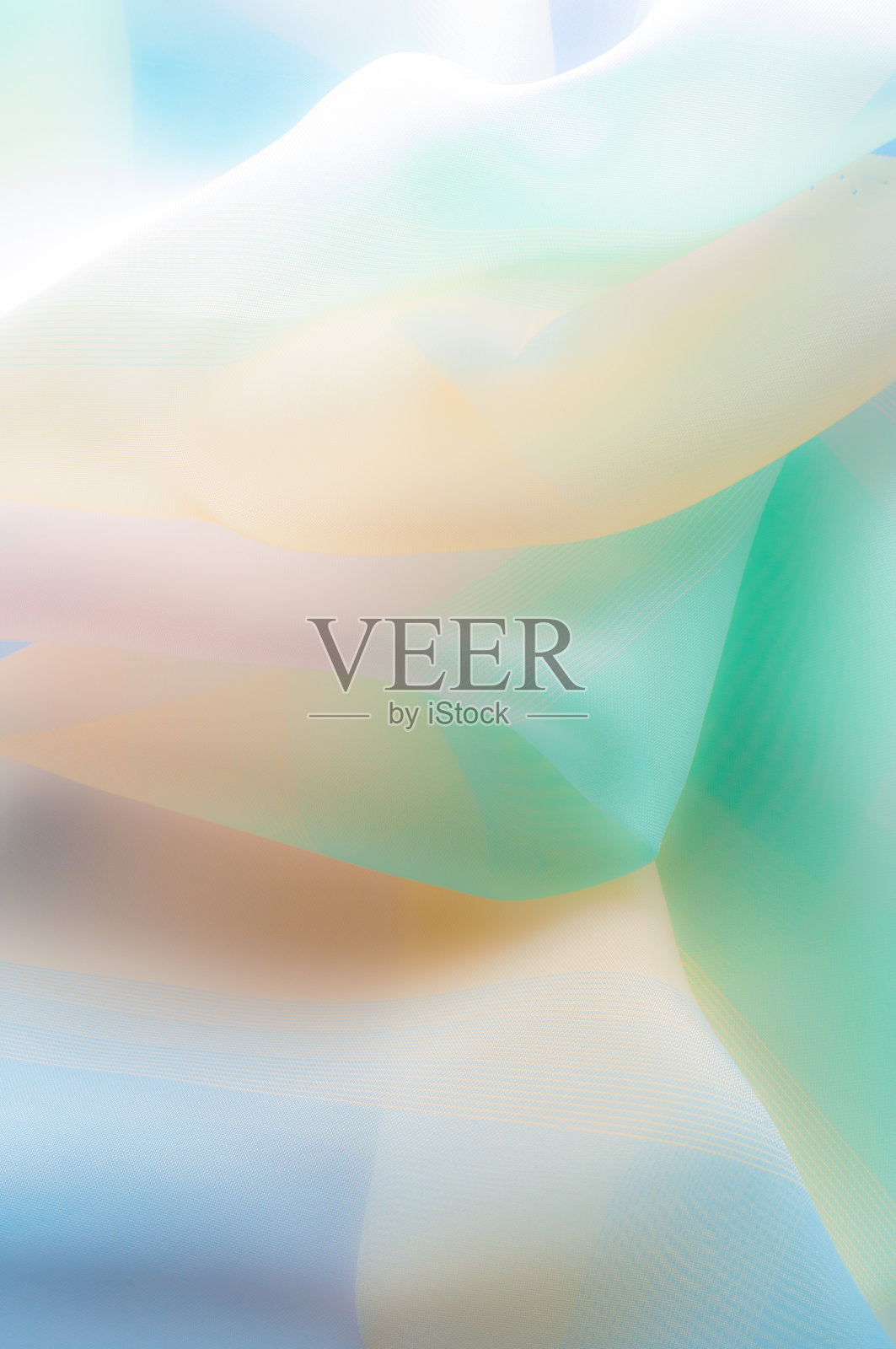 模糊,不是锐利的锐度。质地、背景、模式。丝织品模糊,不锐。质地、背景、模式。丝绸织物是透明的,黄粉绿中带蓝色。抽象柔软的雪纺纹理背景。照片摄影图片