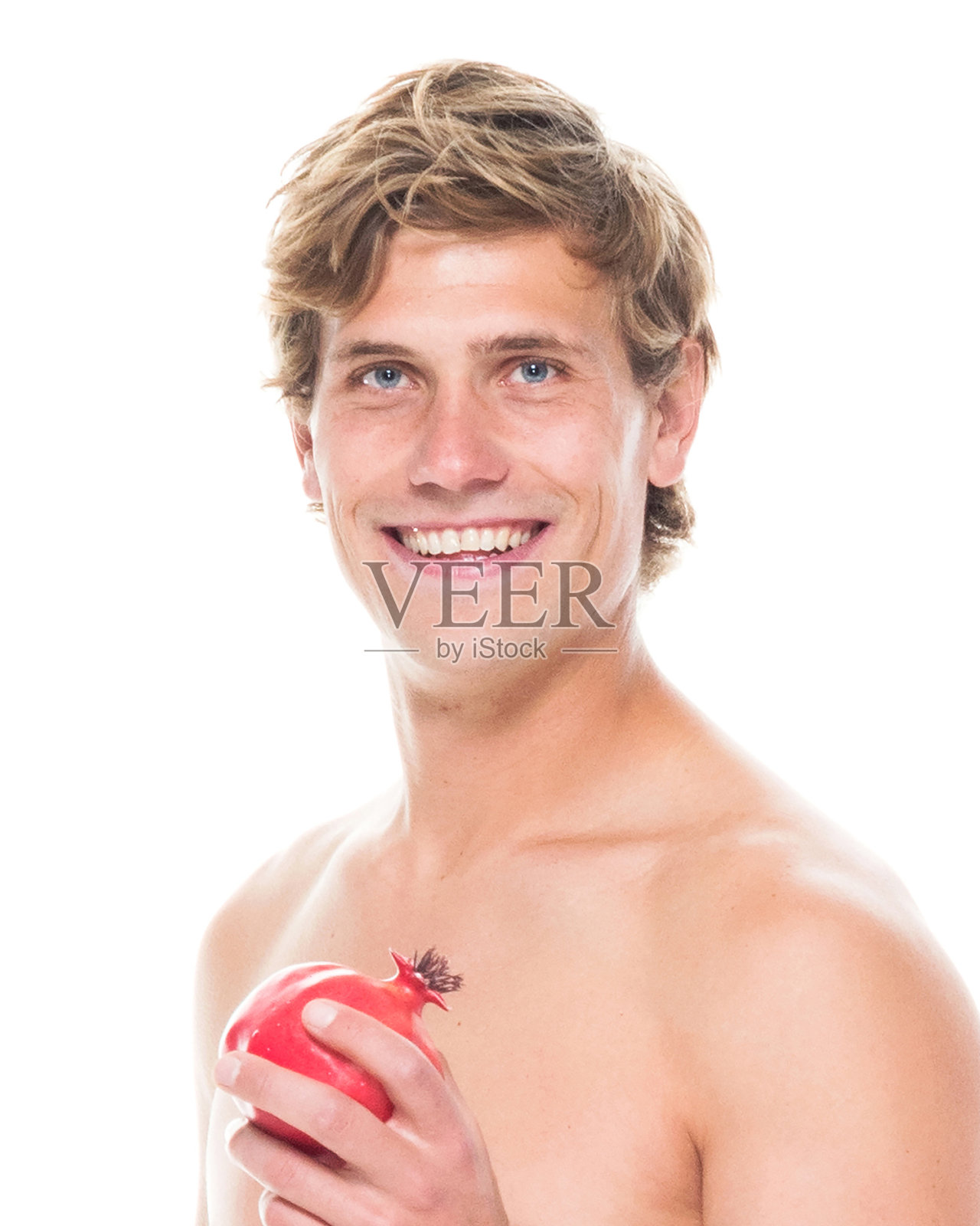 迷人的赤膊男子在运动服装持有水果照片摄影图片