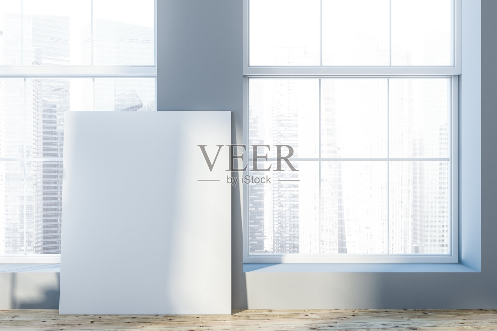 空荡荡的灰色房间里贴着海报照片摄影图片