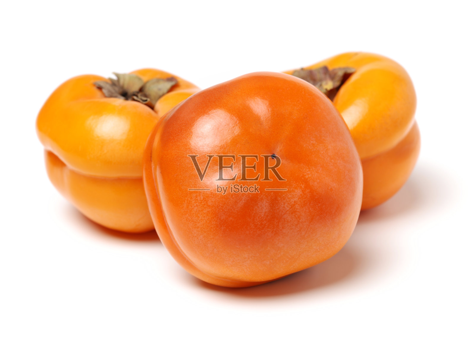 柿子在日本分开的柿子牡蛎上有白色的背景照片摄影图片