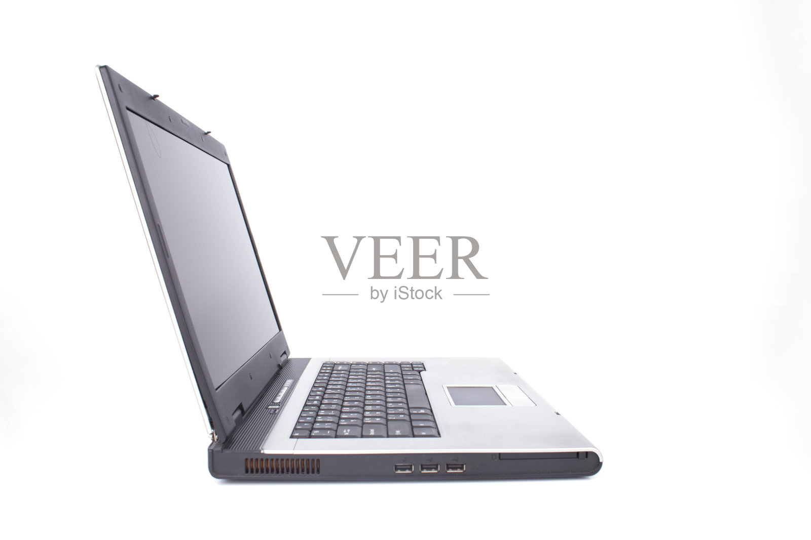 侧面面对笔记本电脑或笔记本电脑的白色背景照片摄影图片