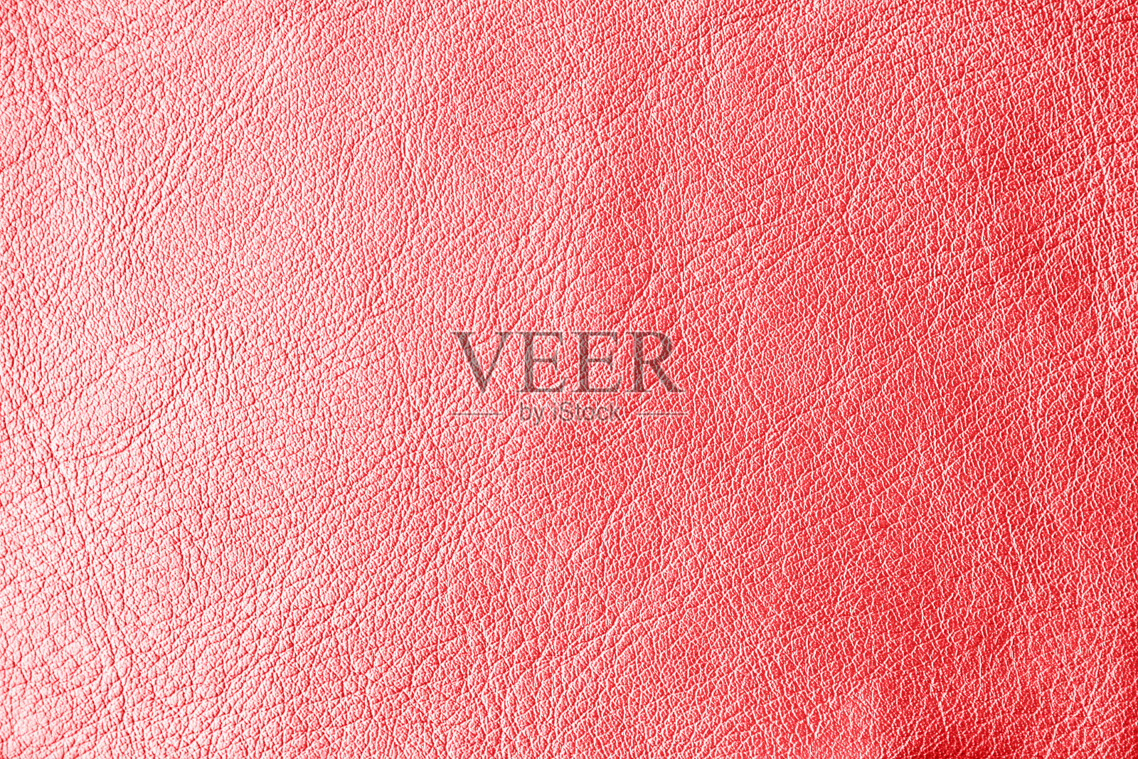 浅亮橙色天然皮革皮肤纹理。照片摄影图片