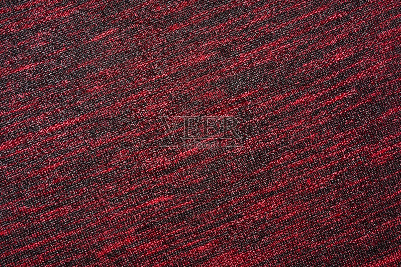 红色针织面料的纹理作为背景照片摄影图片