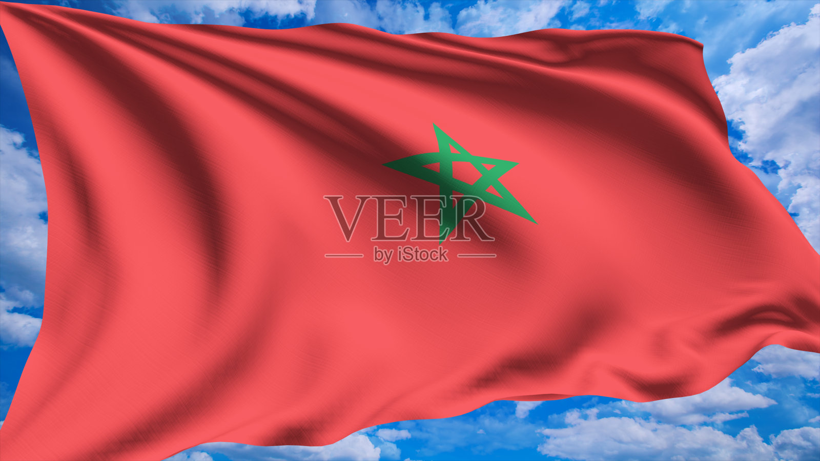 多云天空下织物结构的摩洛哥国旗照片摄影图片