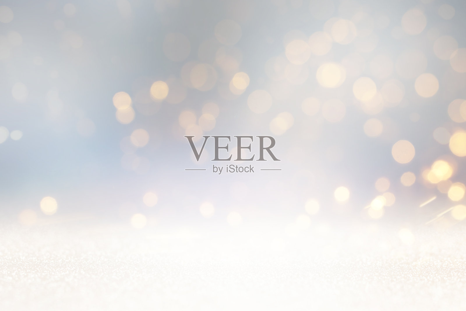 闪闪发光的银色和镀金的灯光背景。de-focused照片摄影图片