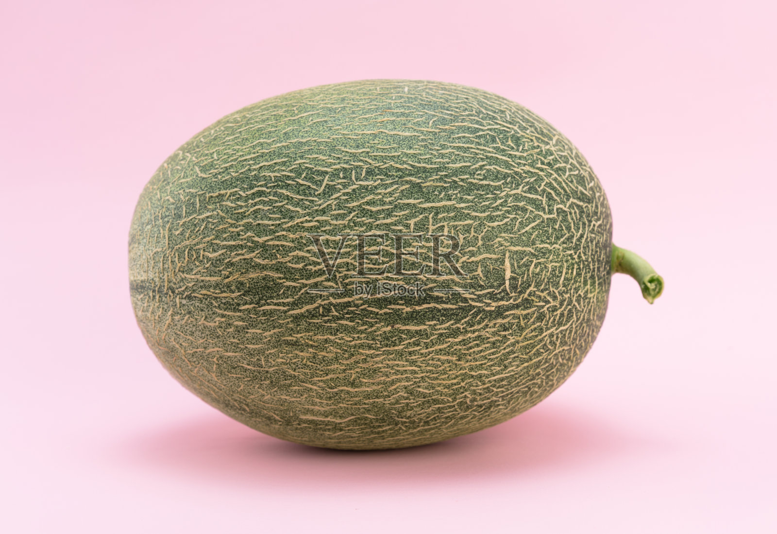 粉红背景上的哈密瓜照片摄影图片