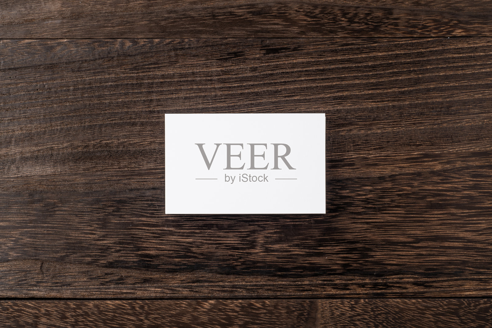 木地板上的白色名片俯视图照片摄影图片