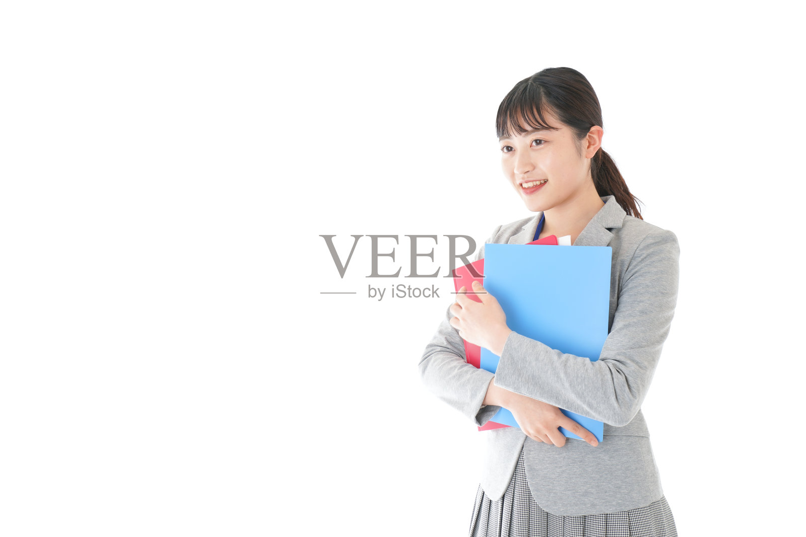 年轻的女商人拿着一把锉刀照片摄影图片