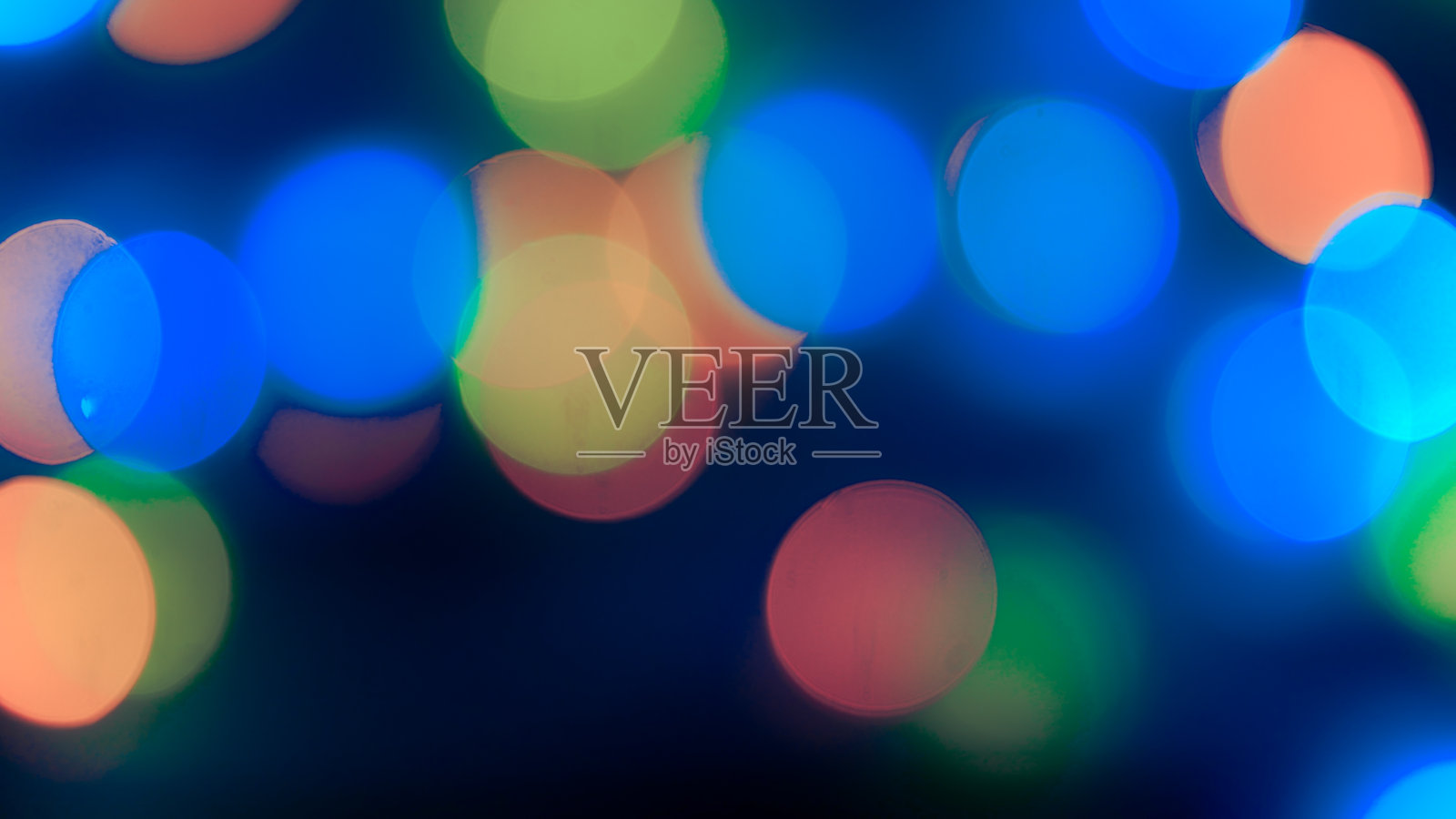 五颜六色的散焦光。抽象的背景。照片摄影图片