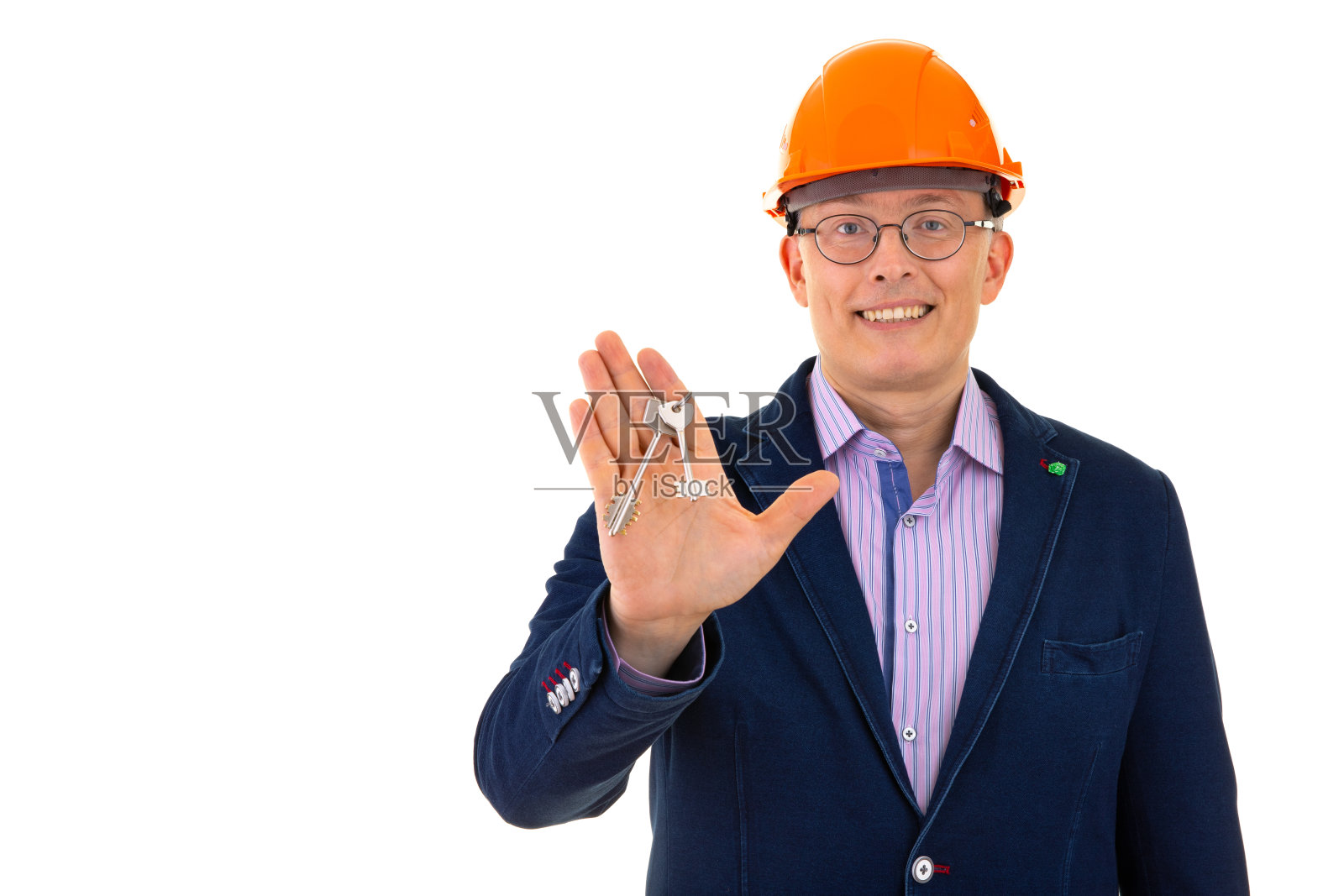 戴安全帽的人拿出两把钥匙照片摄影图片