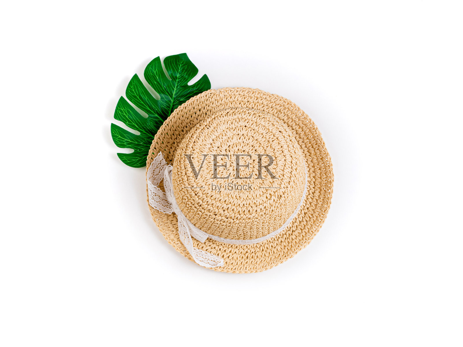 夏季背景草帽和热带棕榈叶怪物。女性夏季配件。夏天,服装,时尚,假期,旅游照片摄影图片