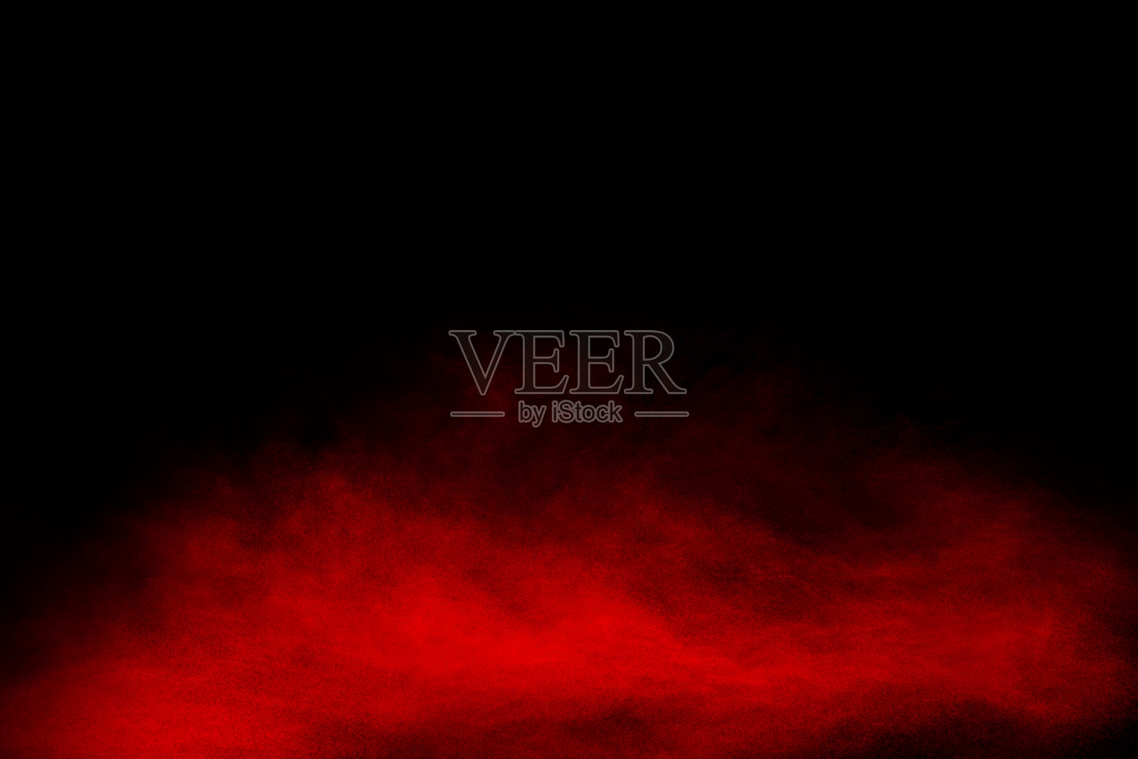 红色火药爆炸云在黑色背景。冻结运动的红色尘埃颗粒飞溅。照片摄影图片