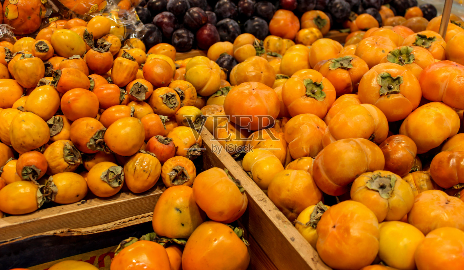 柿子成熟的橘子。照片摄影图片