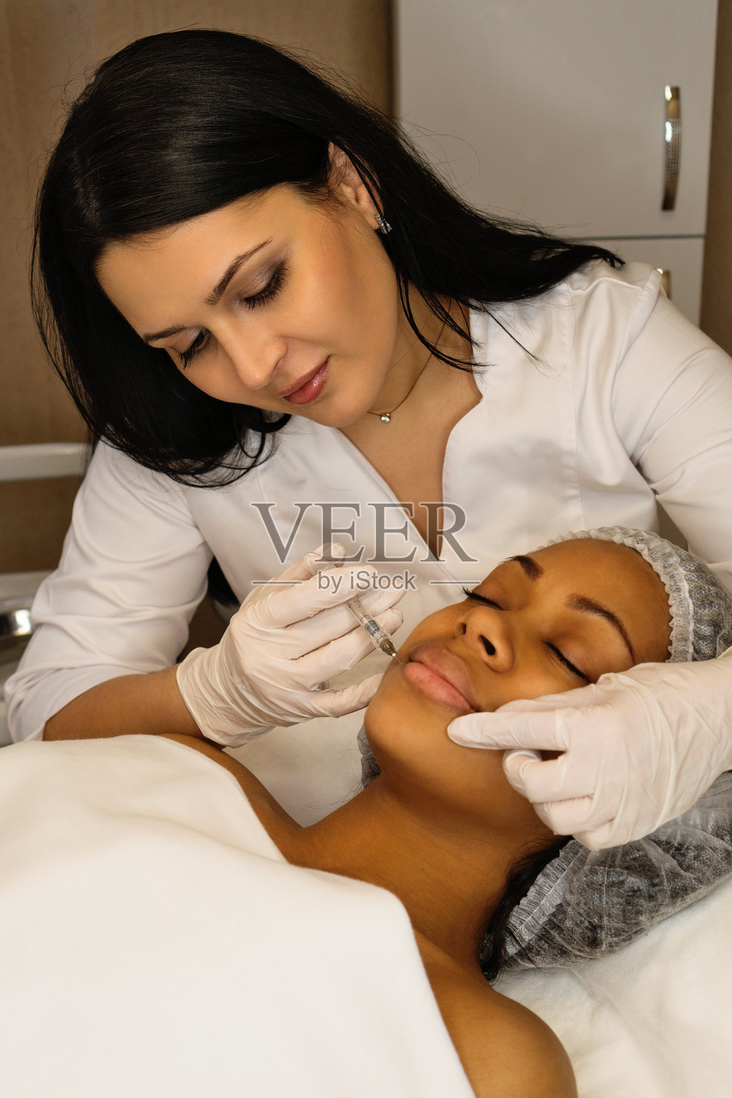 审美矫正治疗。填充剂注射照片摄影图片