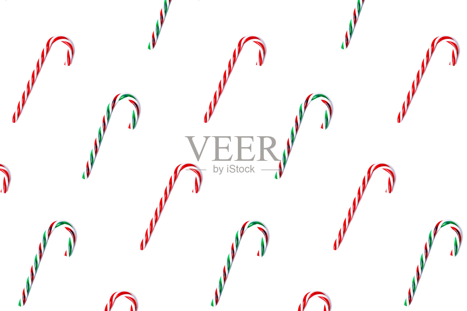 绿色和红色糖果拐杖图案孤立在白色,顶视图。照片摄影图片