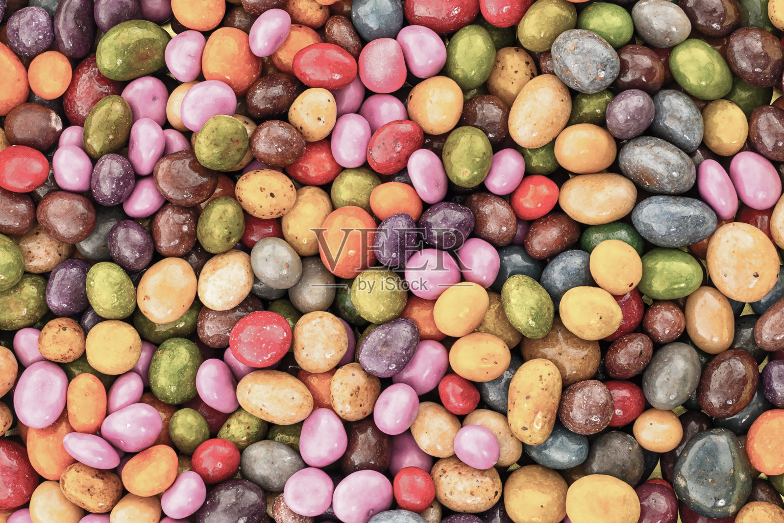 背景糖果许多糖果深棕色黄色淡紫色釉面纹理照片摄影图片