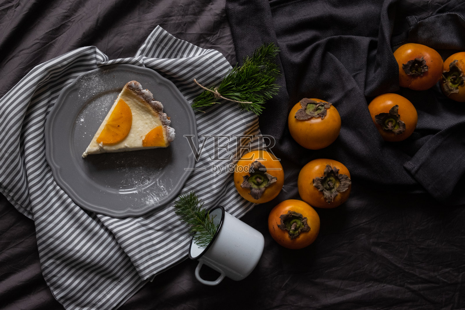 圣诞柿子饼。芝士蛋糕。新年甜点照片摄影图片