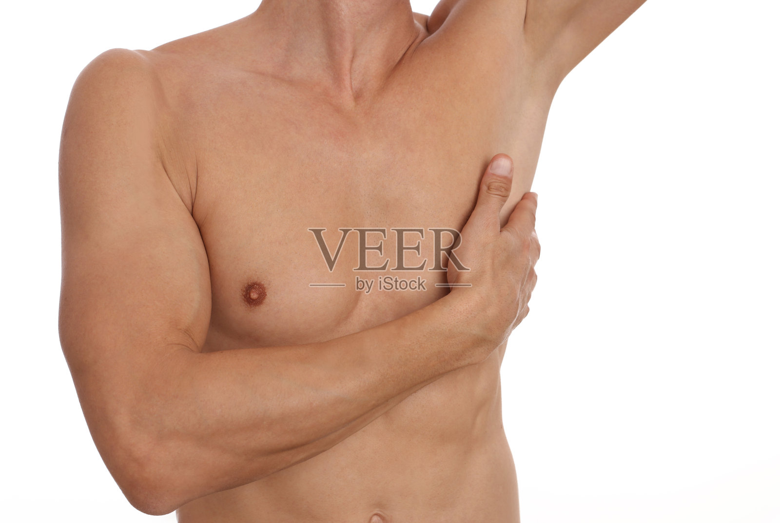 肌肉发达的男性躯干,胸部和腋毛去除。男性打蜡。男性激光拔毛。照片摄影图片