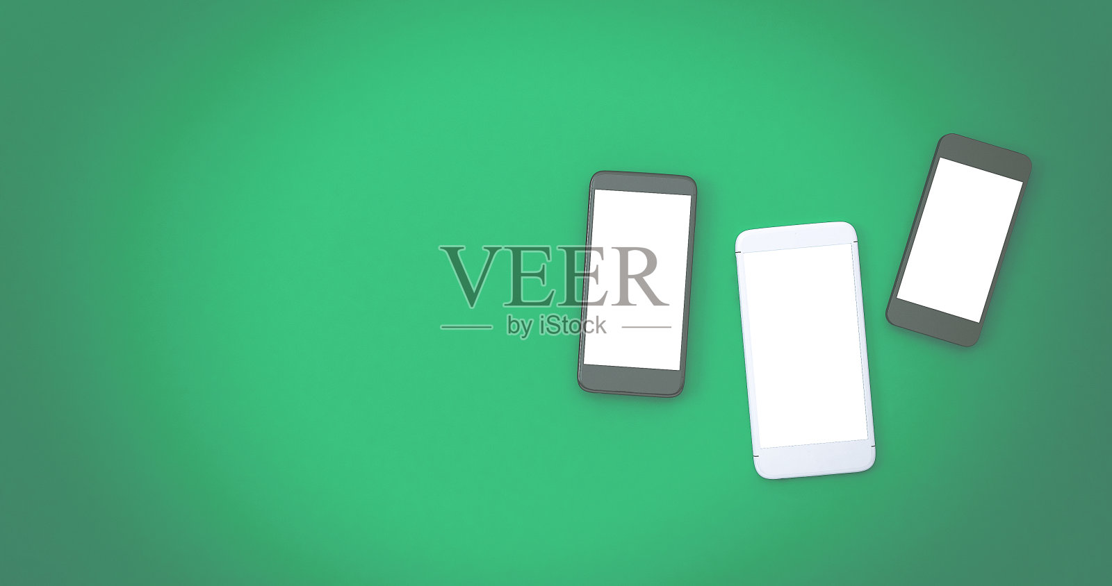 手机屏幕与复制空间在绿色背景照片摄影图片