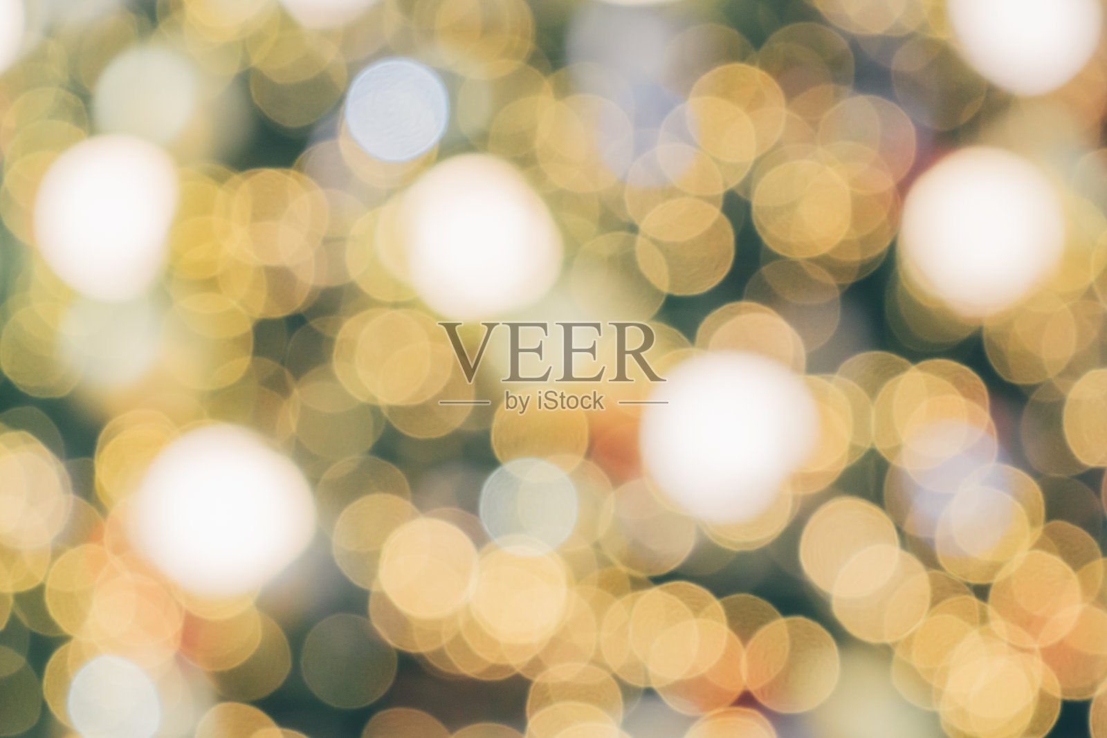 抽象的圣诞假期与节日金色散景灯树模糊的背景照片摄影图片