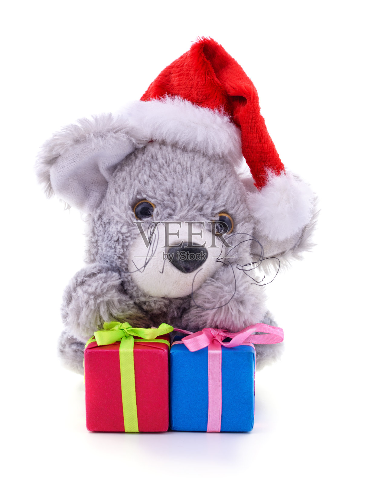 帽子里的玩具老鼠,圣诞老人带着圣诞礼物。照片摄影图片