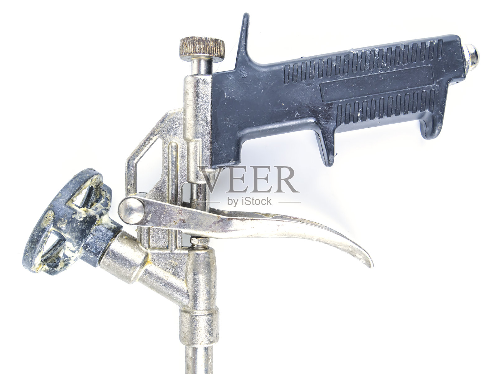 安装泡沫的施工工具枪。照片摄影图片