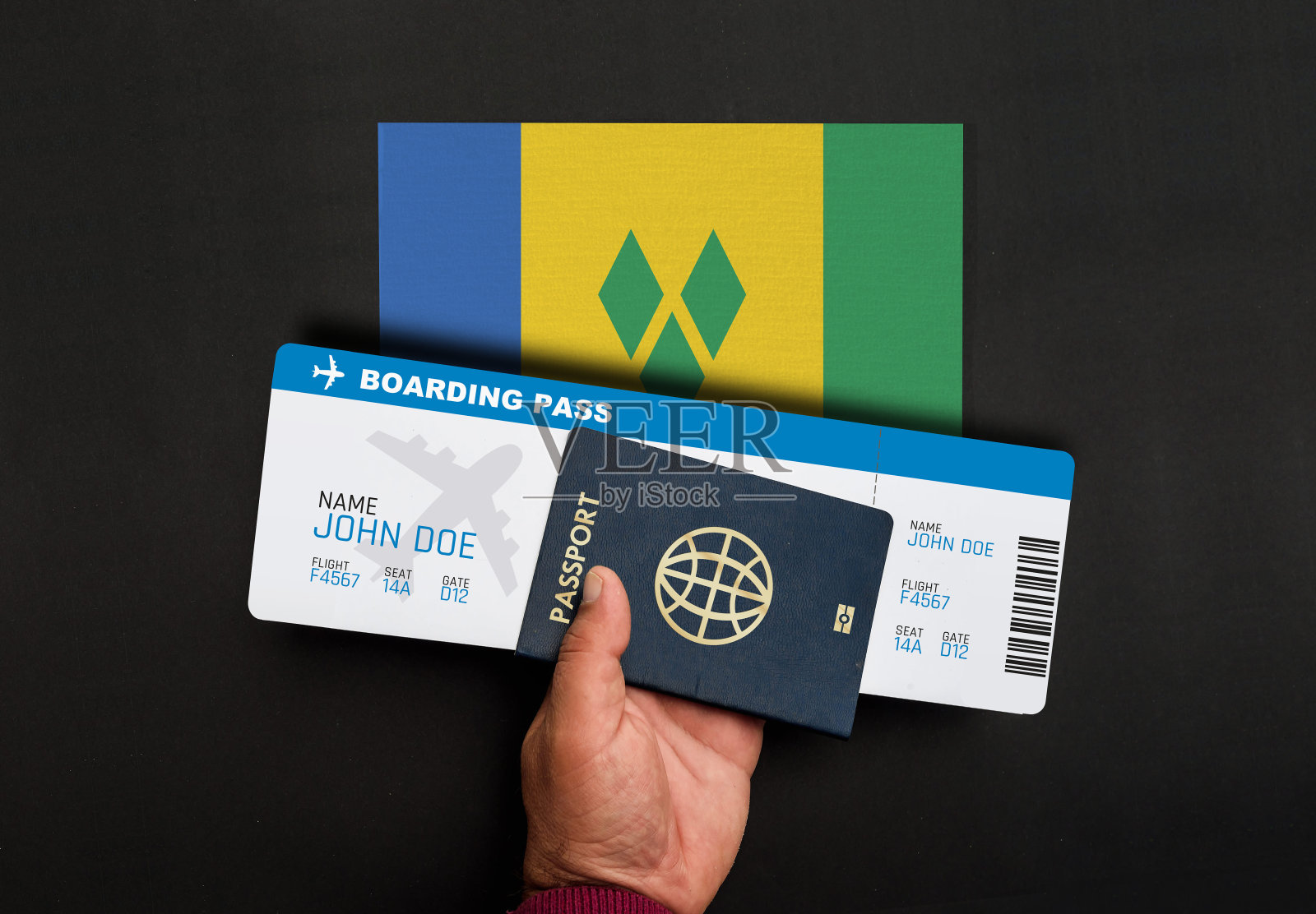 护照、登机牌和圣文森特和格林纳丁斯国旗照片摄影图片
