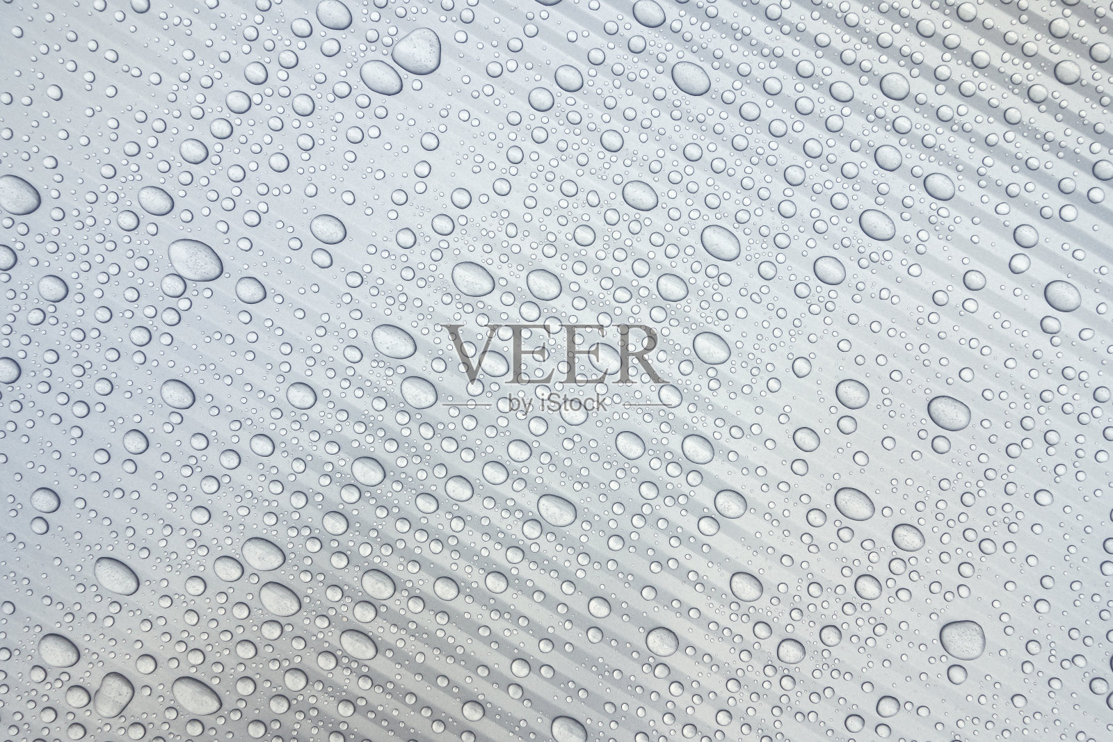 浅灰色塑料表面有水滴照片摄影图片