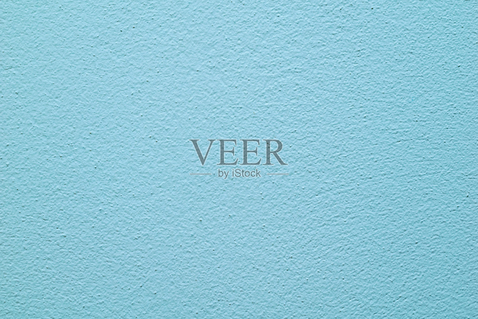 蓝色的墙壁,有明显的灰泥纹理照片摄影图片