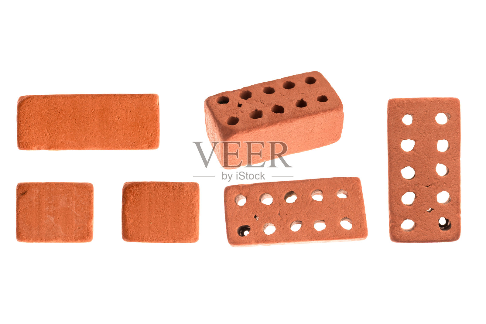 装饰、饰面、陶瓷、红色,用于不同焦点和截面上有孔的建筑用砖。孤立在白色背景上照片摄影图片