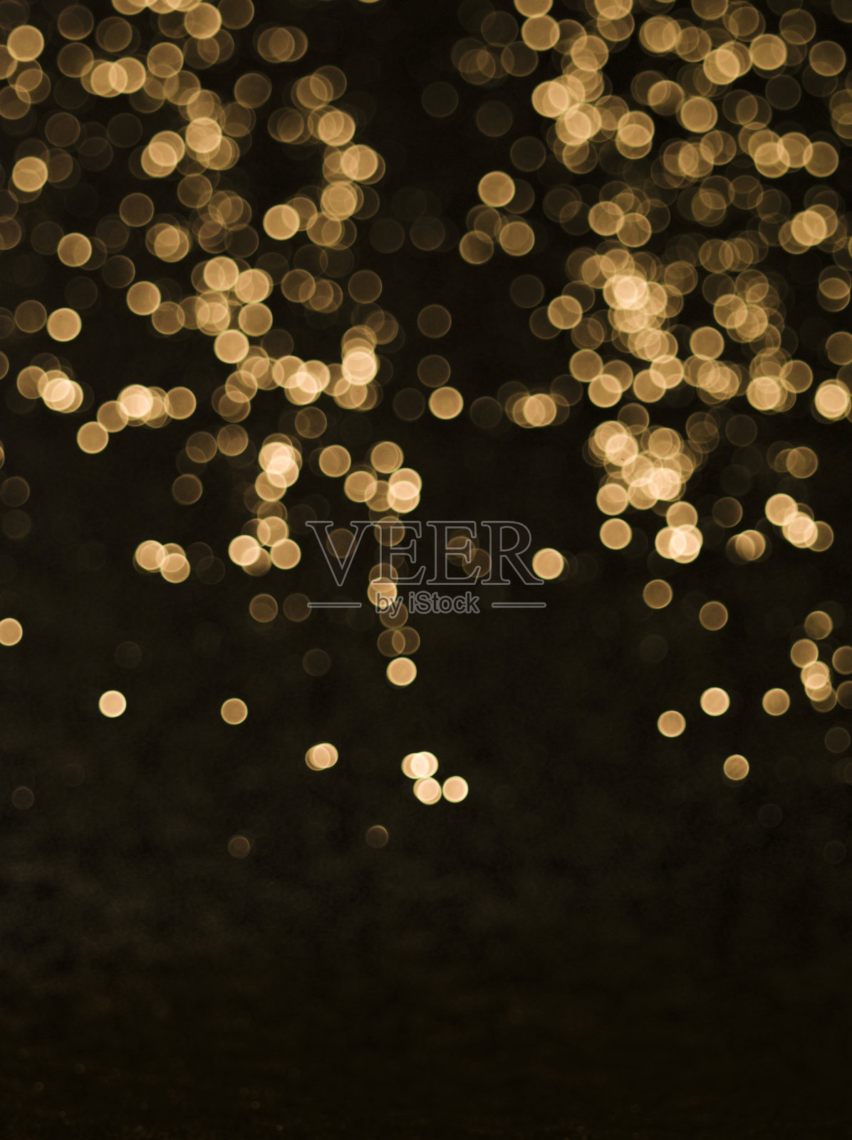 背景的抽象闪烁灯金色和黑色的聚焦照片摄影图片