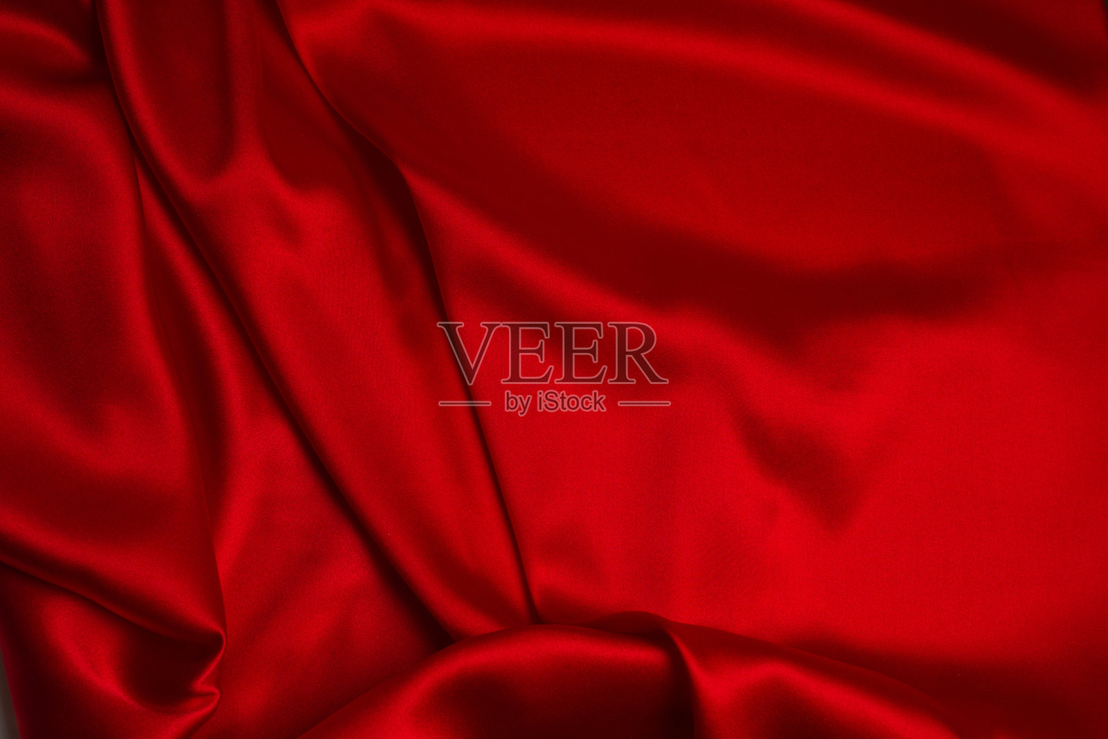 红色丝绸或豪华缎纹织物可作为抽象背景。照片摄影图片