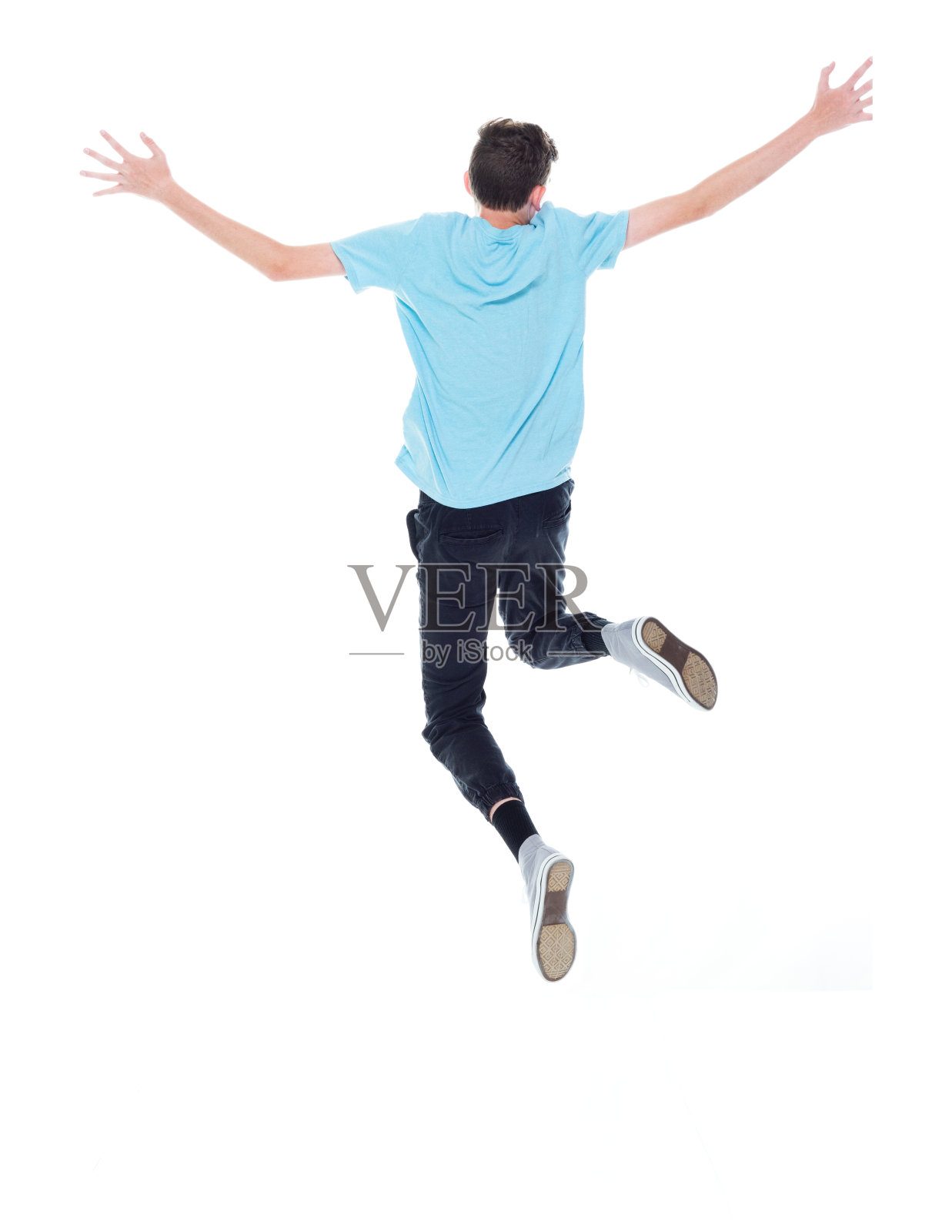 在白色背景前跳跃的年轻白人男性照片摄影图片