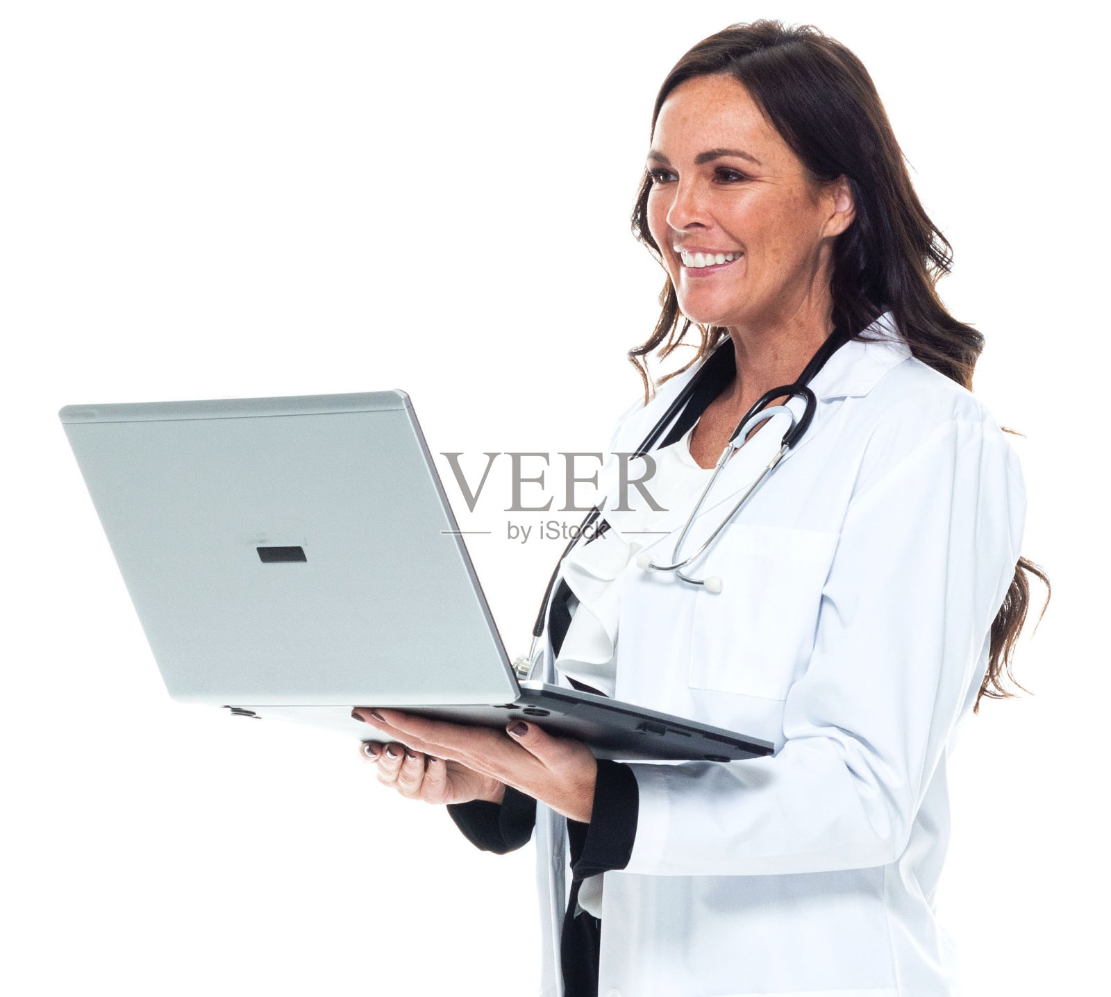 穿着实验服,使用笔记本电脑的年轻白人女医生照片摄影图片