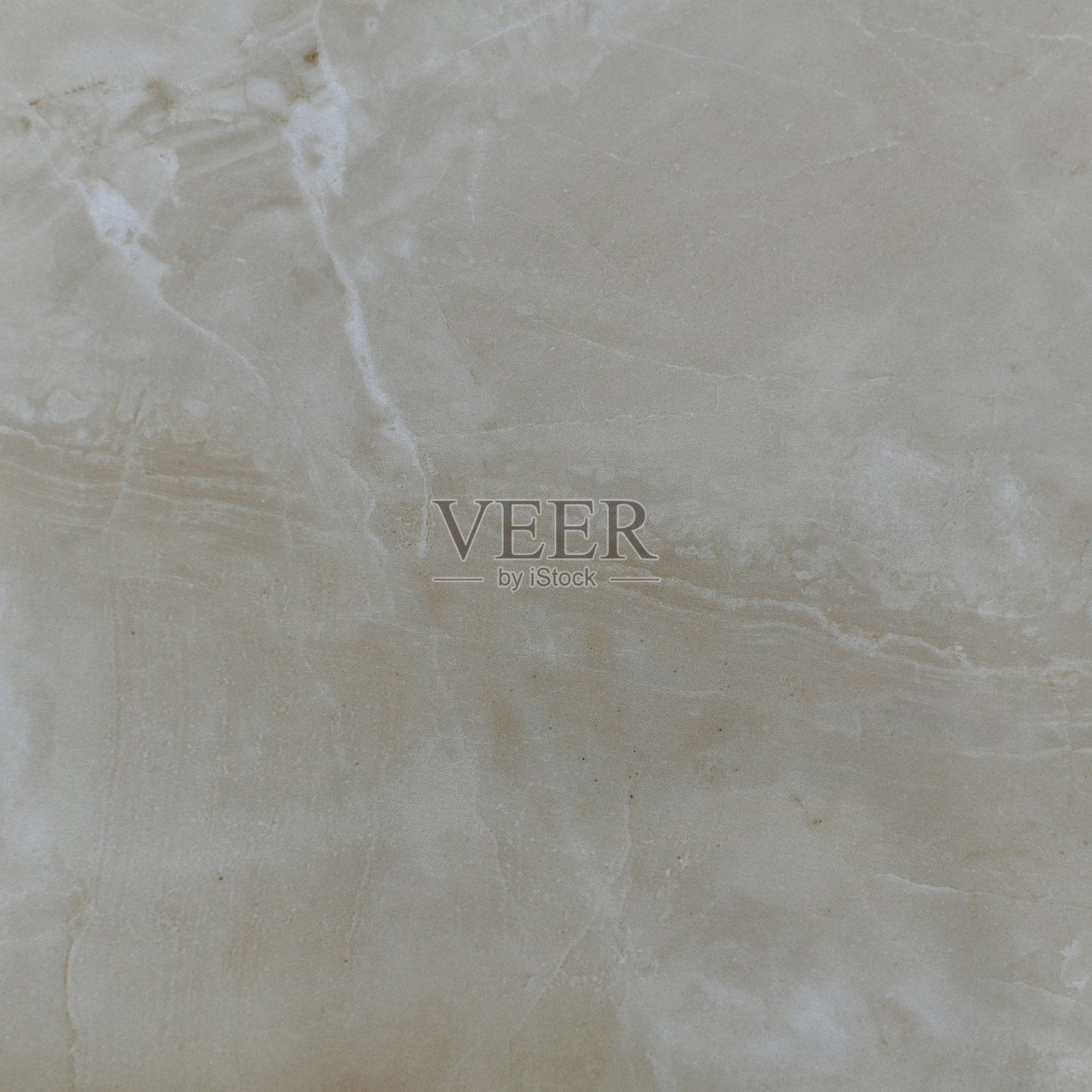 天然米色抛光大理石与一个倾斜的线分隔框架在一半和两个白色拉链从上角。照片摄影图片