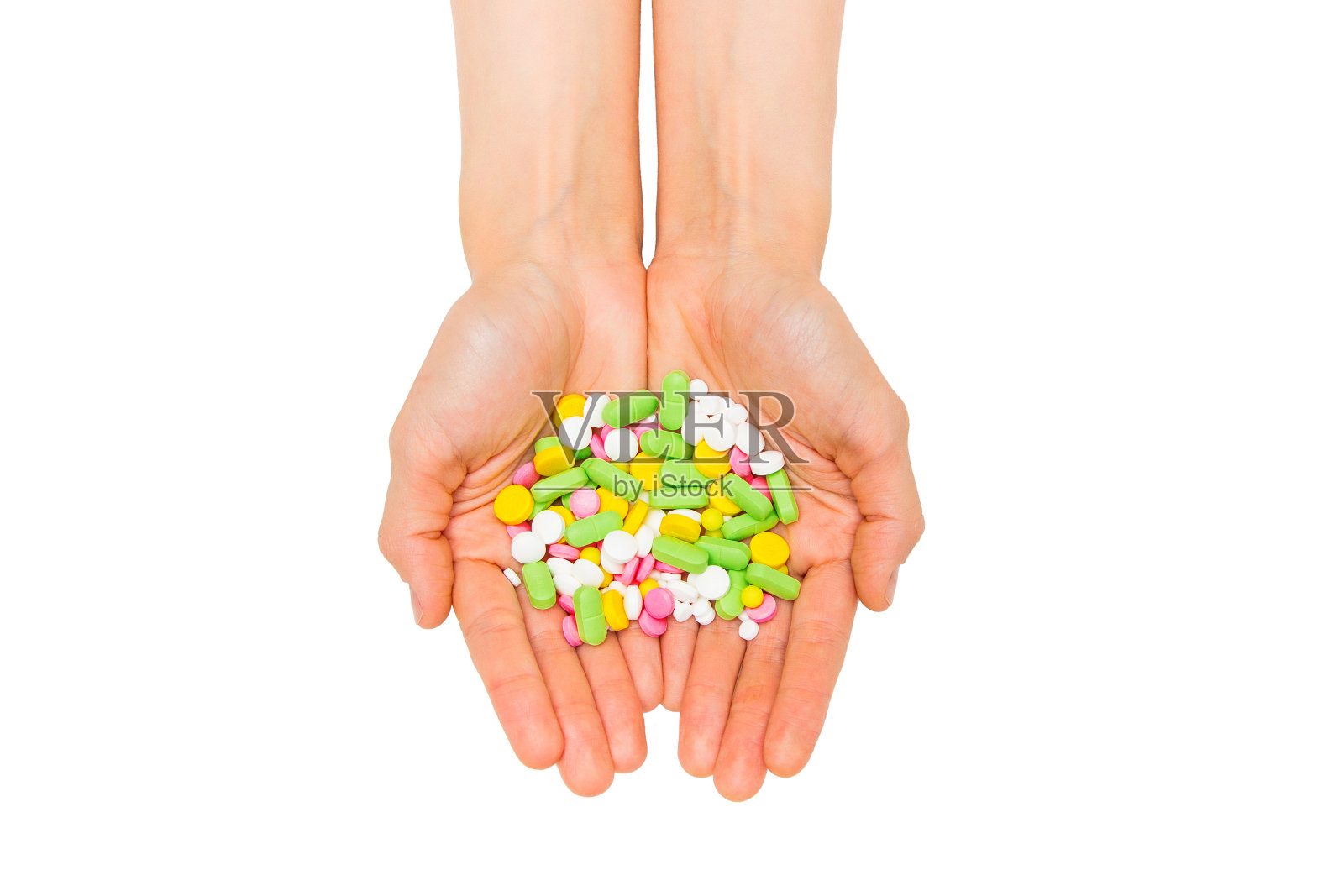 一小撮片剂和药丸在手中孤立白色照片摄影图片