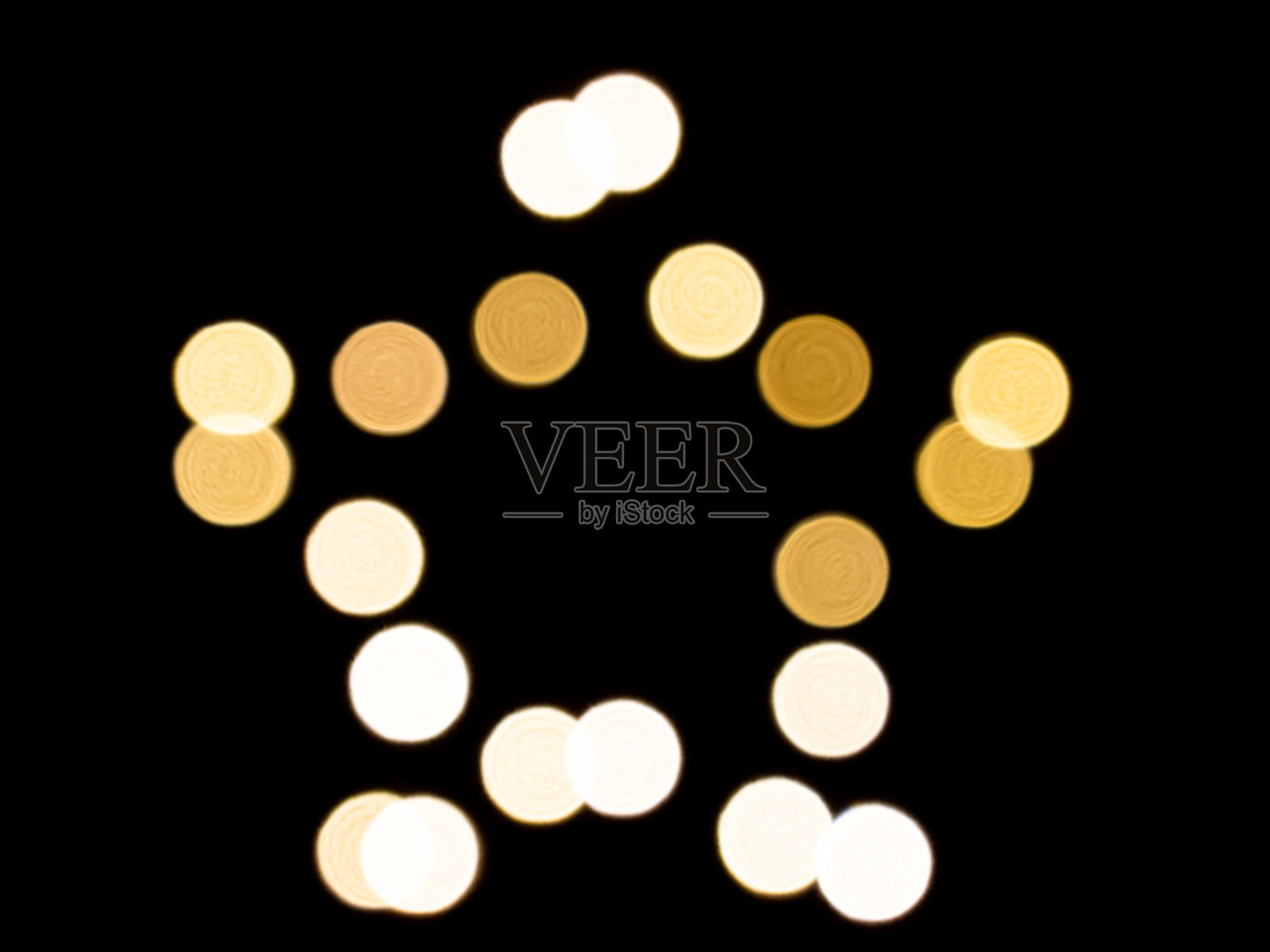 在黑色背景上星形光的散焦图像照片摄影图片