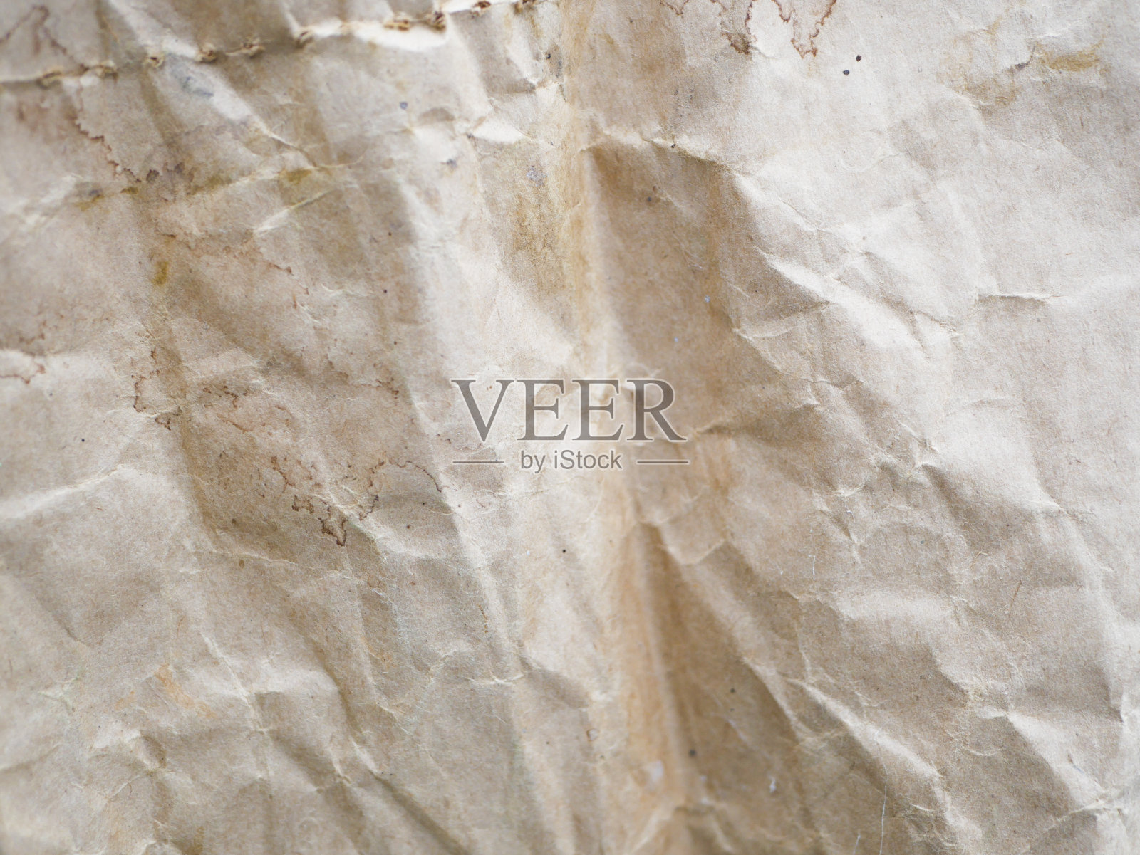 皱巴巴的牛皮纸特写。背景是纸做的。背景纹理照片摄影图片